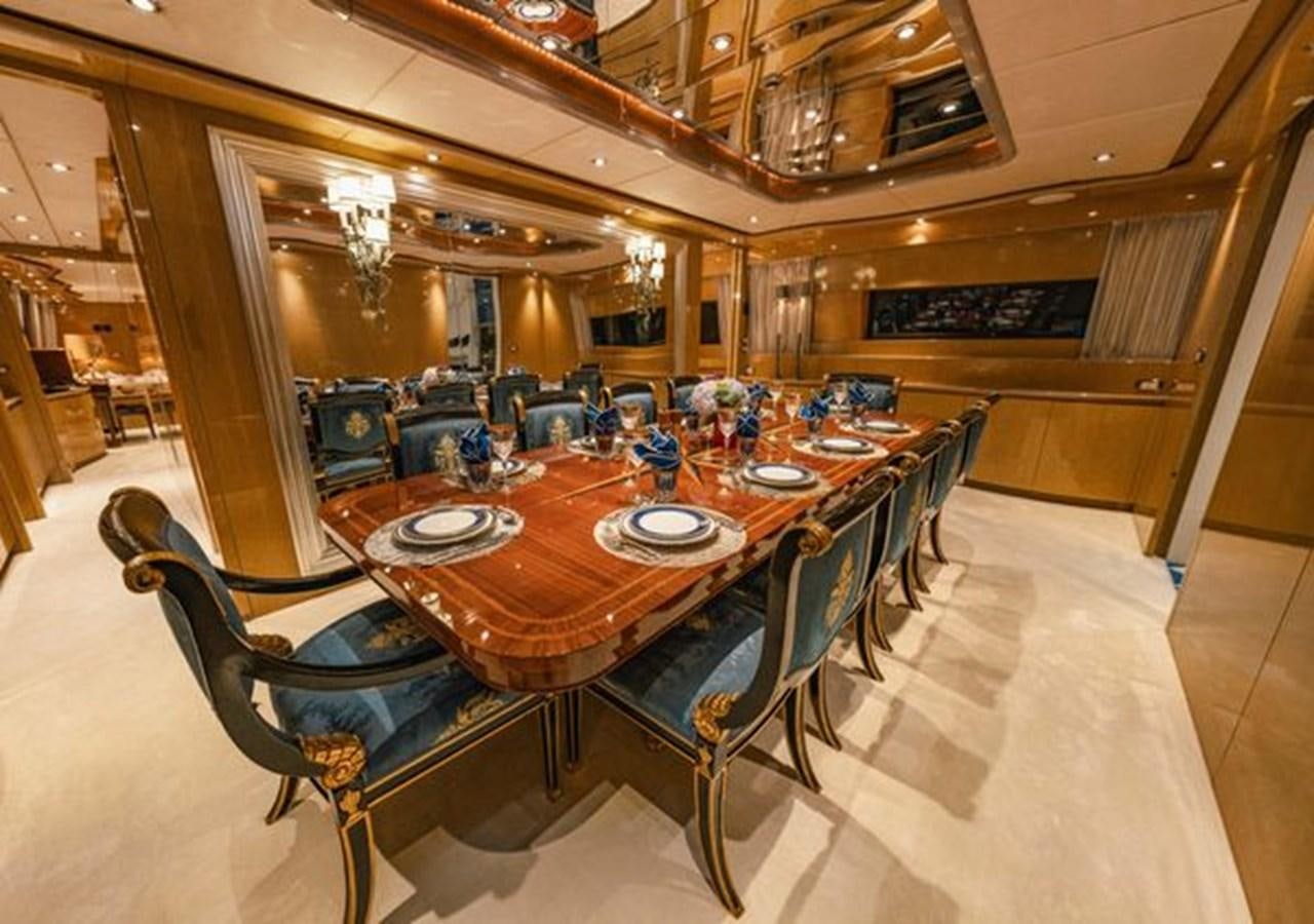 a large dining room with tables and chairs aboard 2003 BAGLIETTO 38M FAST FLY Yacht for Sale