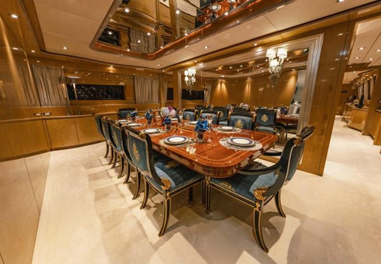 a large dining room with a table aboard 2003 BAGLIETTO 38M FAST FLY Yacht for Sale