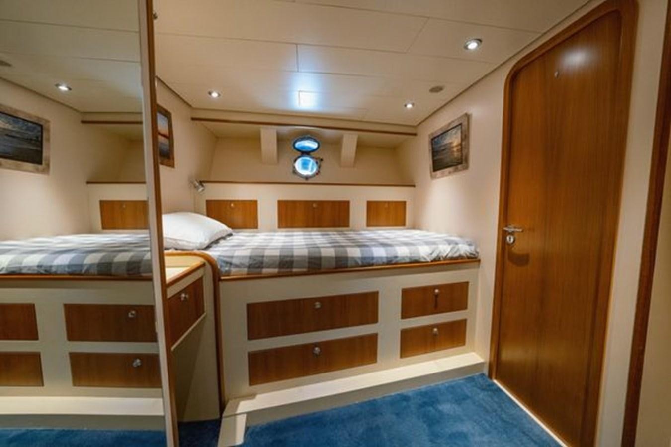 a room with bunk beds aboard 2003 BAGLIETTO 38M FAST FLY Yacht for Sale