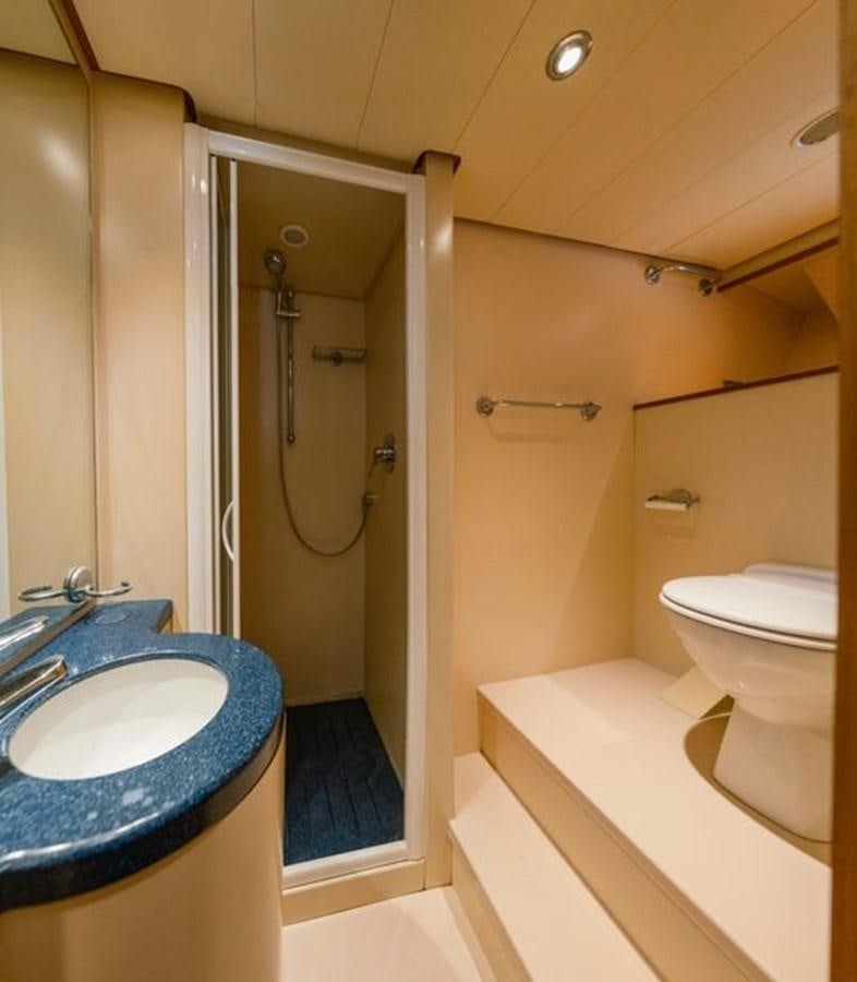 a bathroom with a sink and a toilet aboard 2003 BAGLIETTO 38M FAST FLY Yacht for Sale