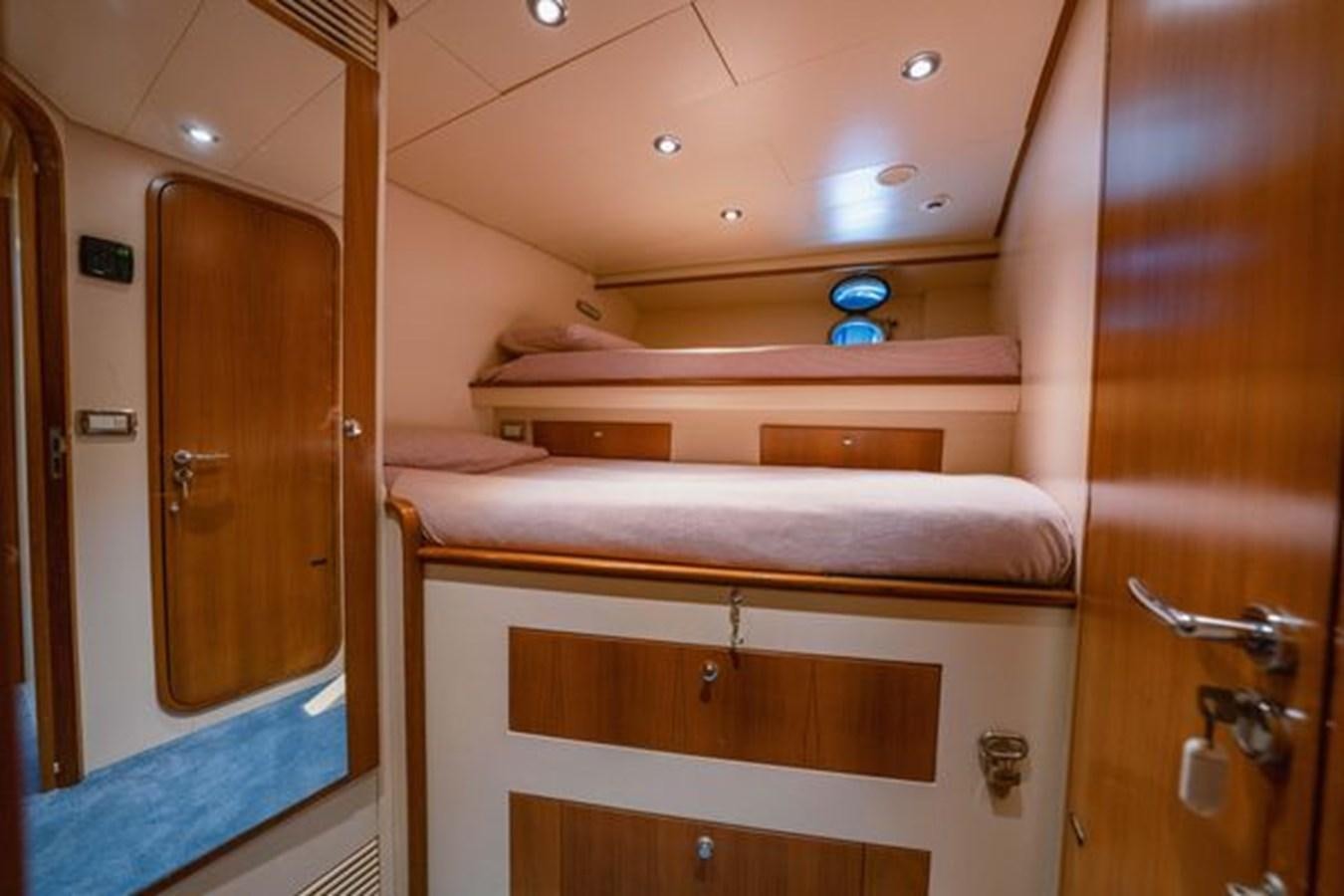 a room with a bunk bed aboard 2003 BAGLIETTO 38M FAST FLY Yacht for Sale