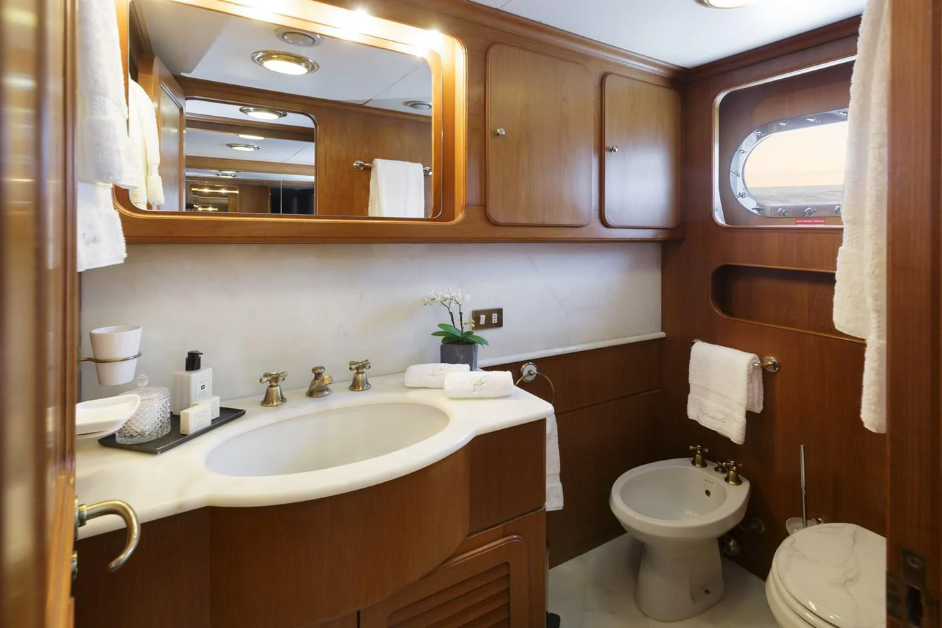 a bathroom with a sink and toilet aboard ESPINOLA Yacht for Sale