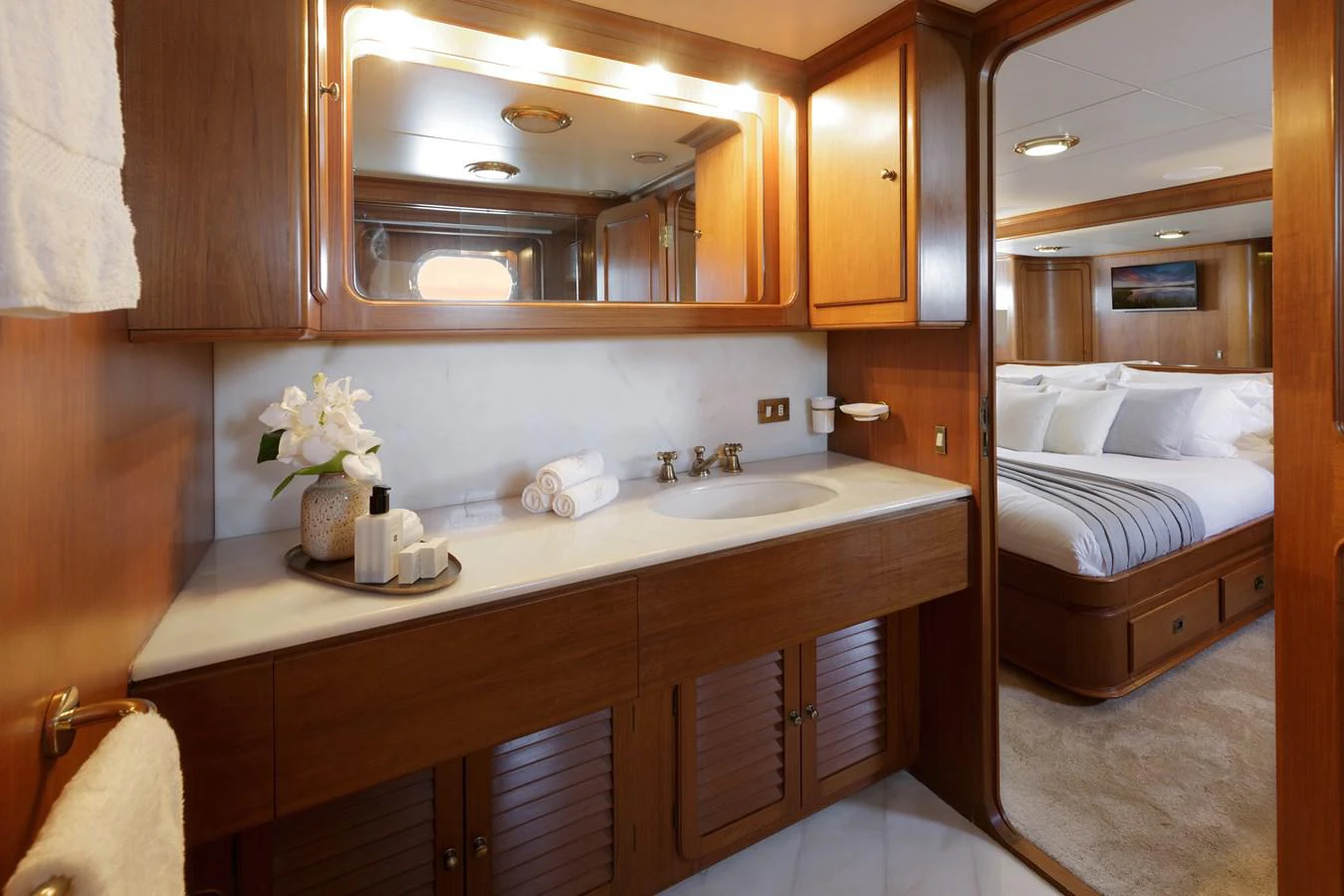 a bathroom with a sink and a bed aboard ESPINOLA Yacht for Sale