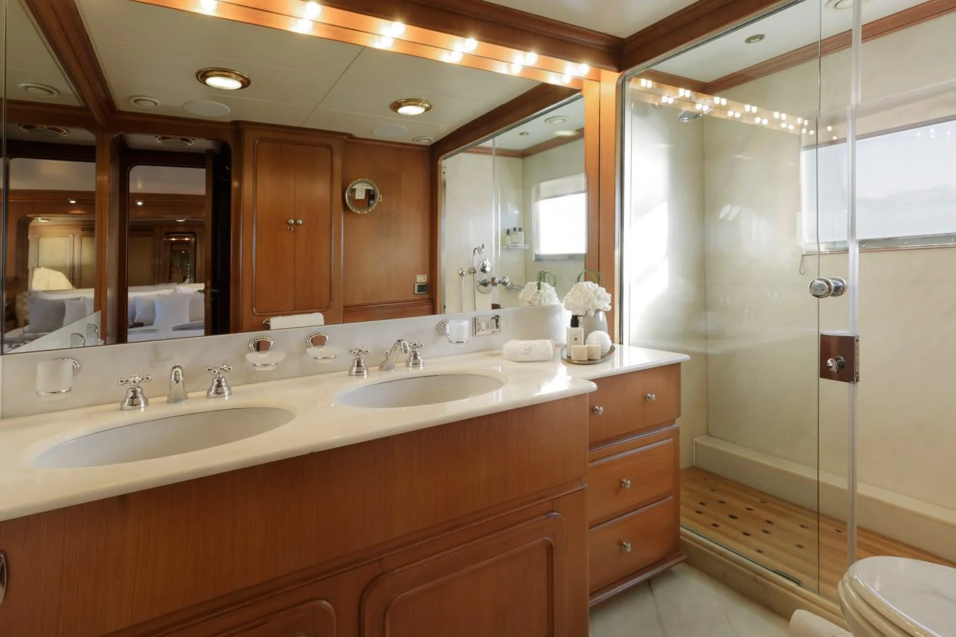 a bathroom with a shower and sinks aboard ESPINOLA Yacht for Sale
