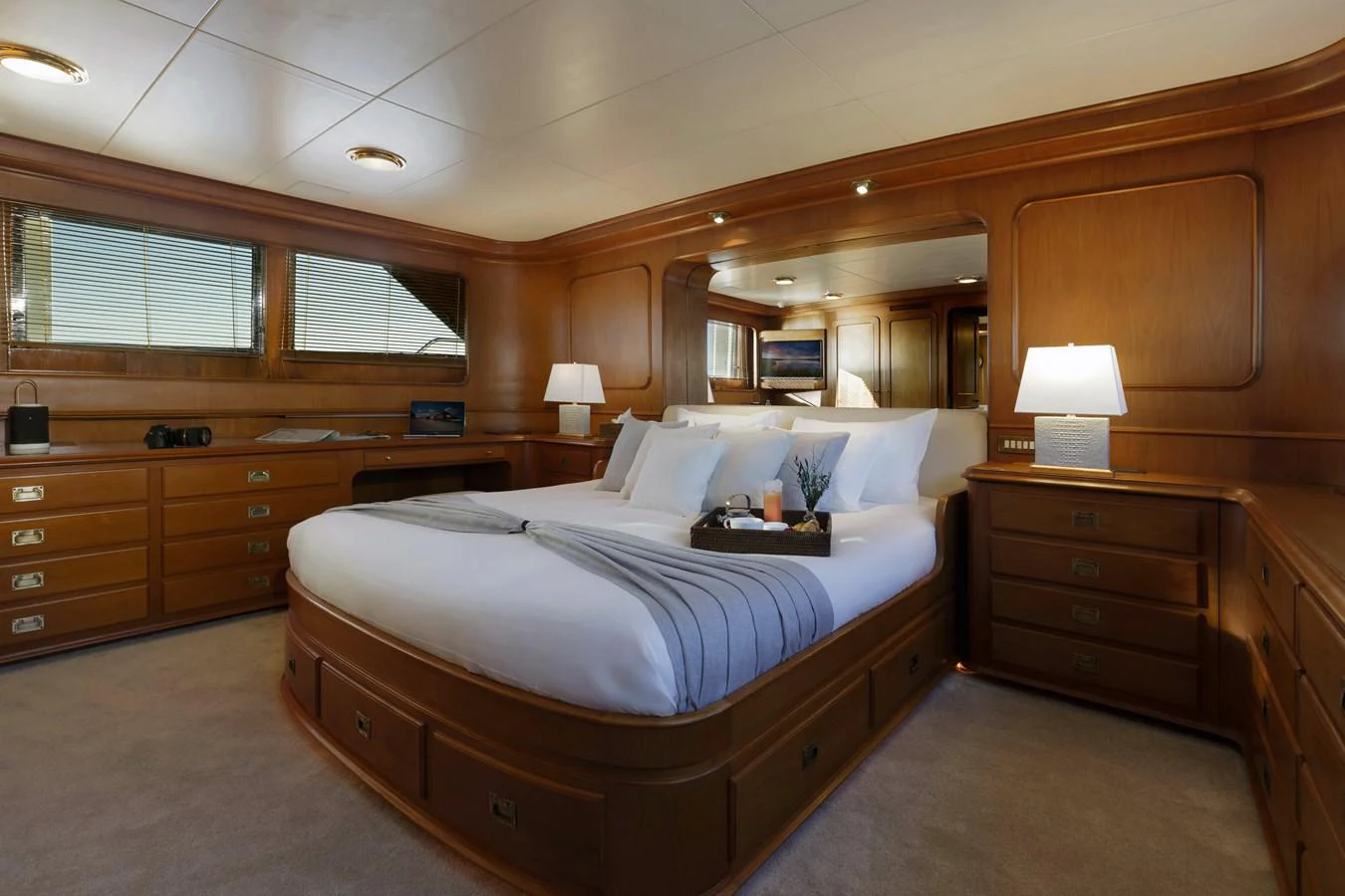 a bedroom with a bed and a dresser aboard ESPINOLA Yacht for Sale