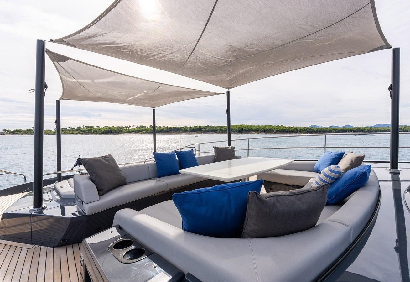 a large white tent with a couch and pillows on it aboard MAJIC Yacht for Sale