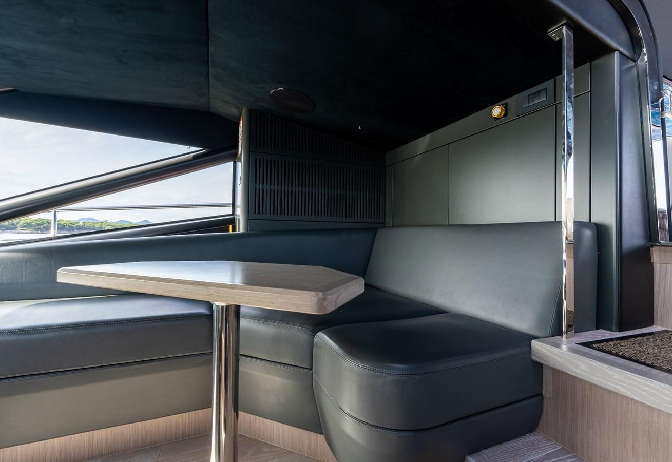 a vehicle with a table and chairs aboard MAJIC Yacht for Sale