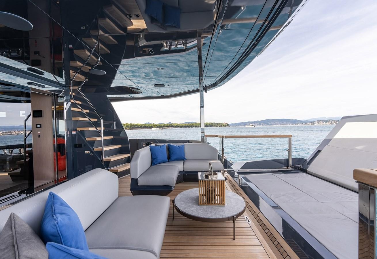 a deck with a view of the ocean and a beach aboard MAJIC Yacht for Sale