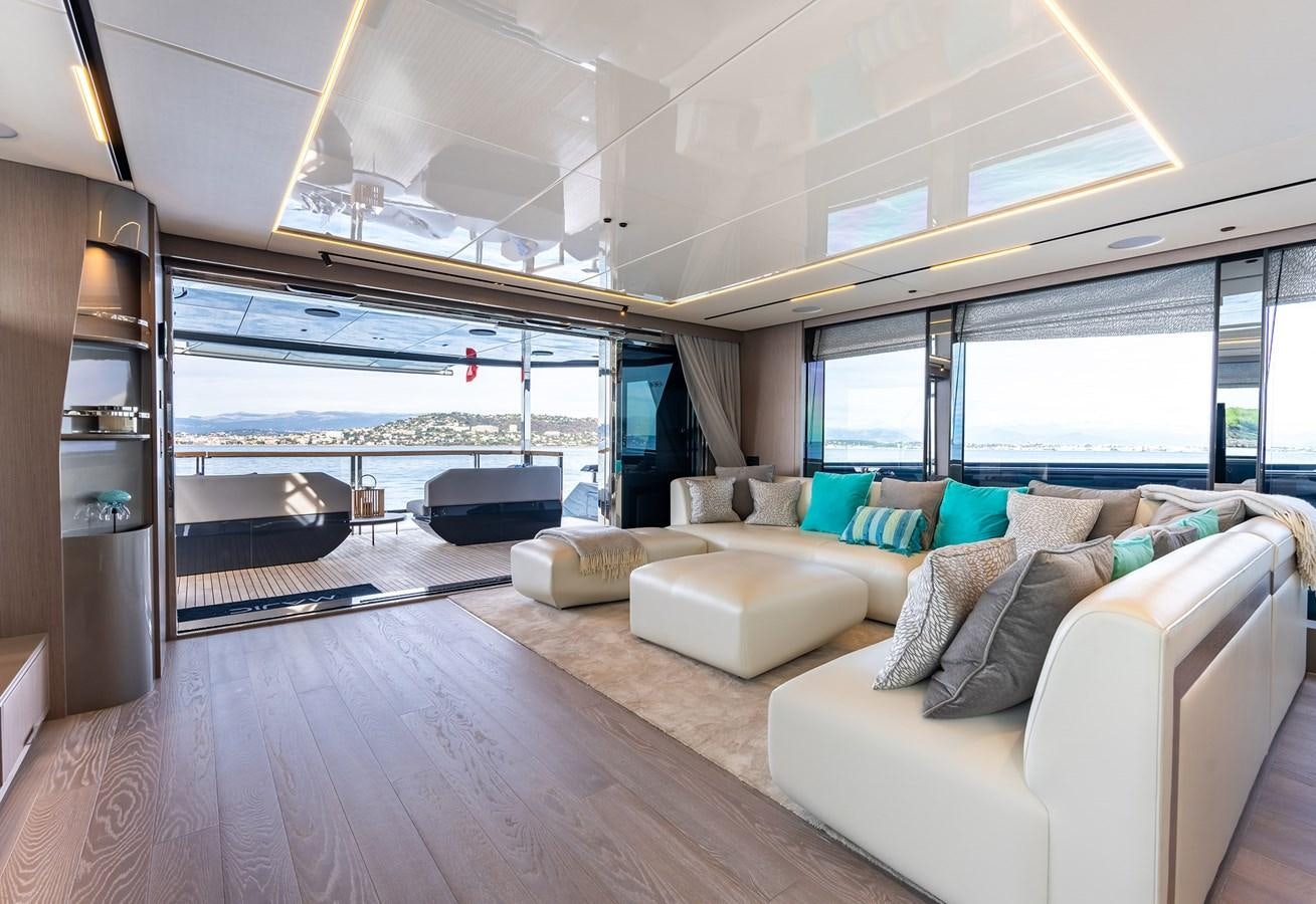 a living room with a large window aboard MAJIC Yacht for Sale