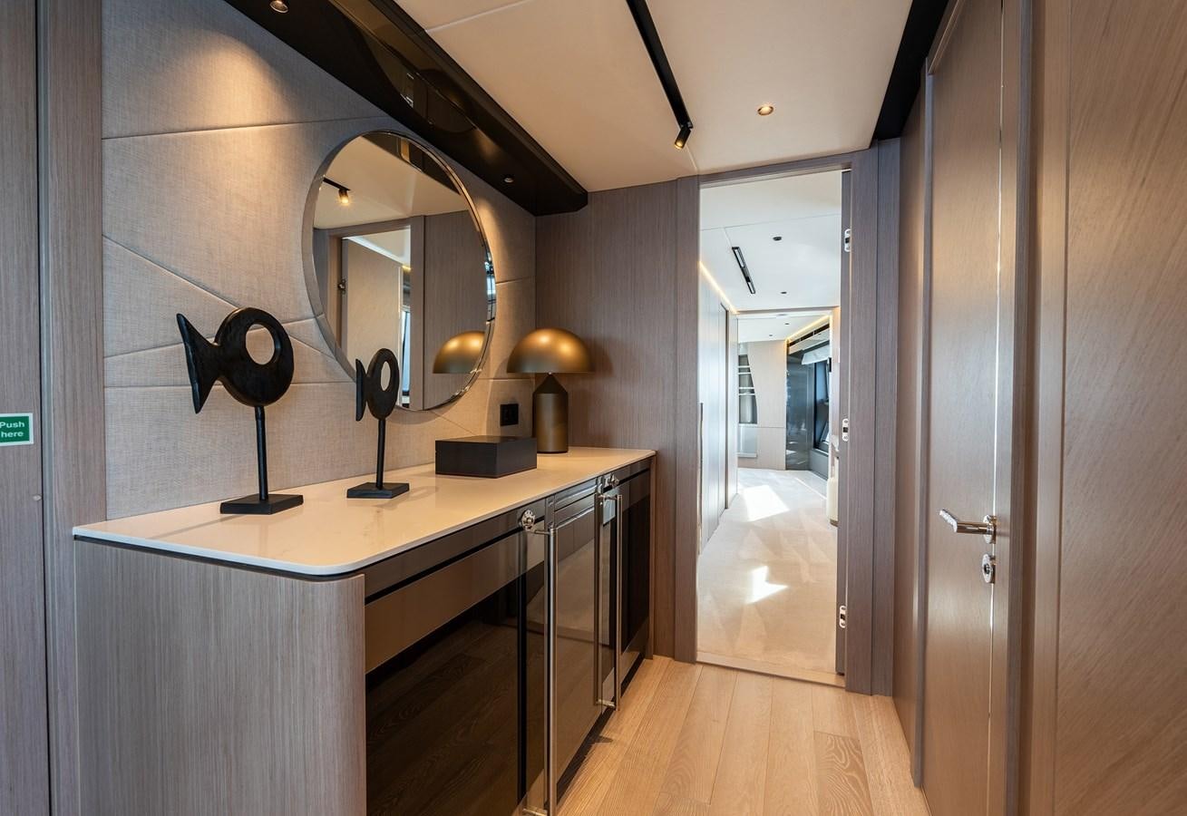 a long counter with a mirror above it aboard MAJIC Yacht for Sale