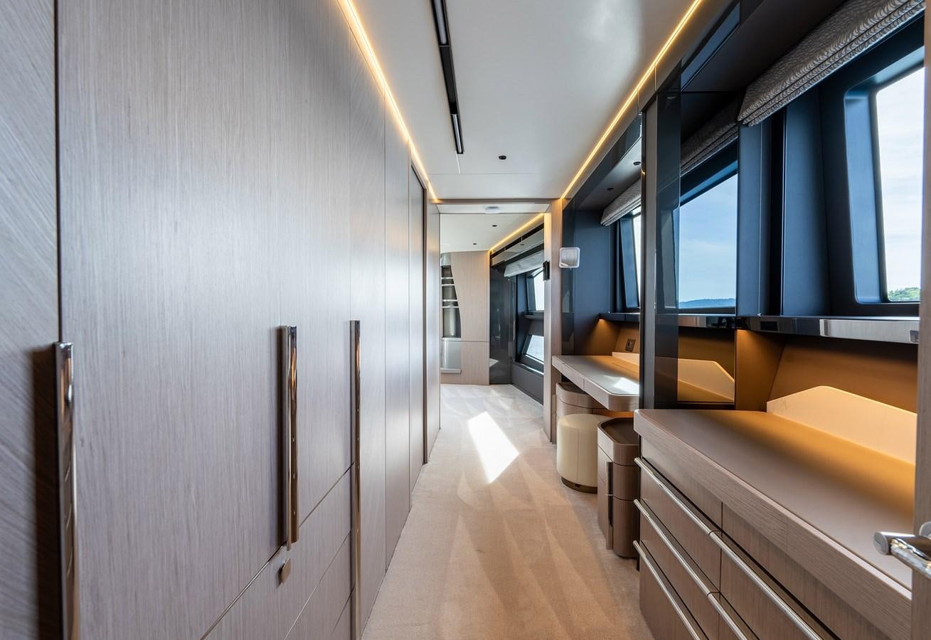a long hallway with a bench aboard MAJIC Yacht for Sale
