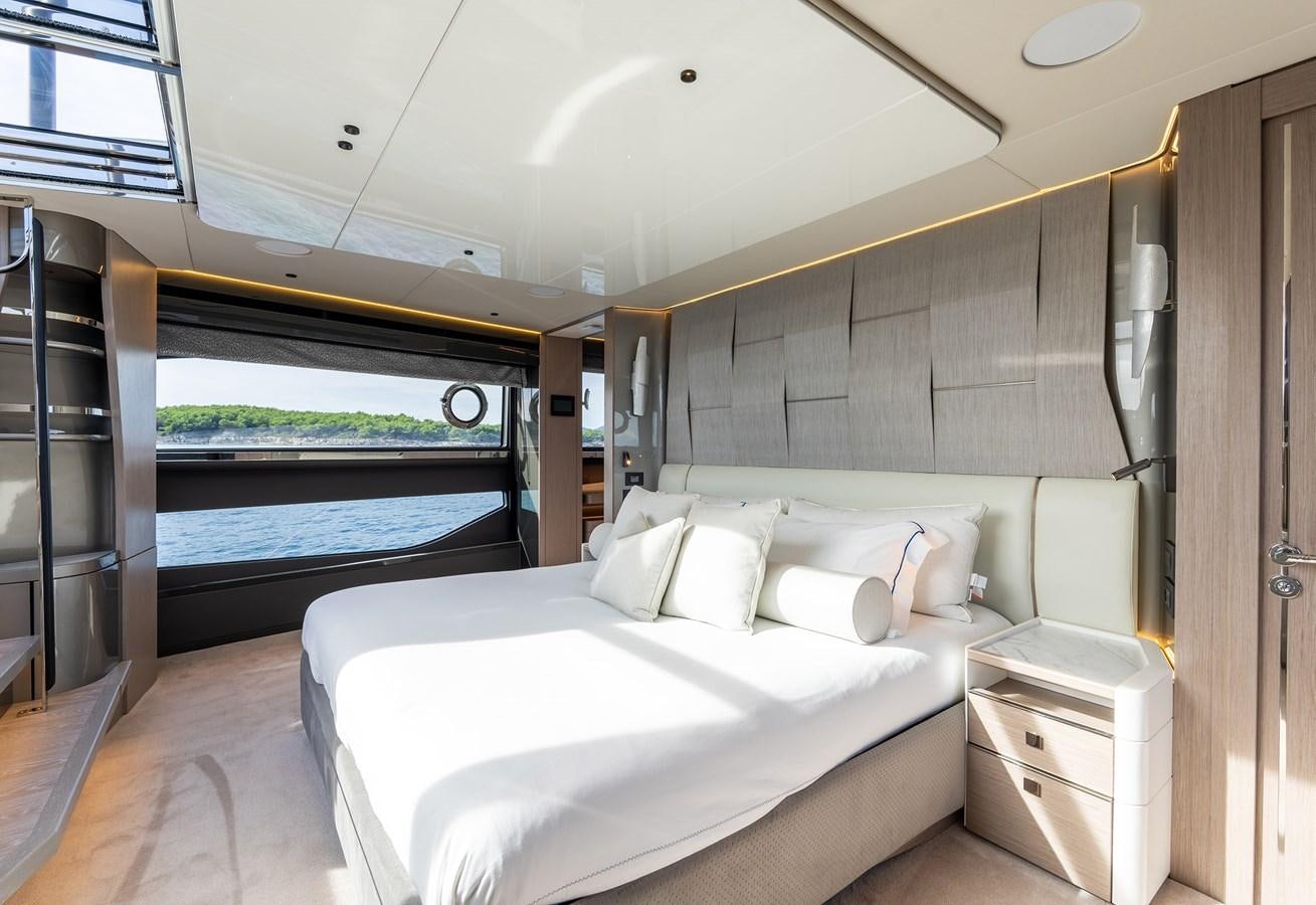 a large bedroom with a large bed aboard MAJIC Yacht for Sale