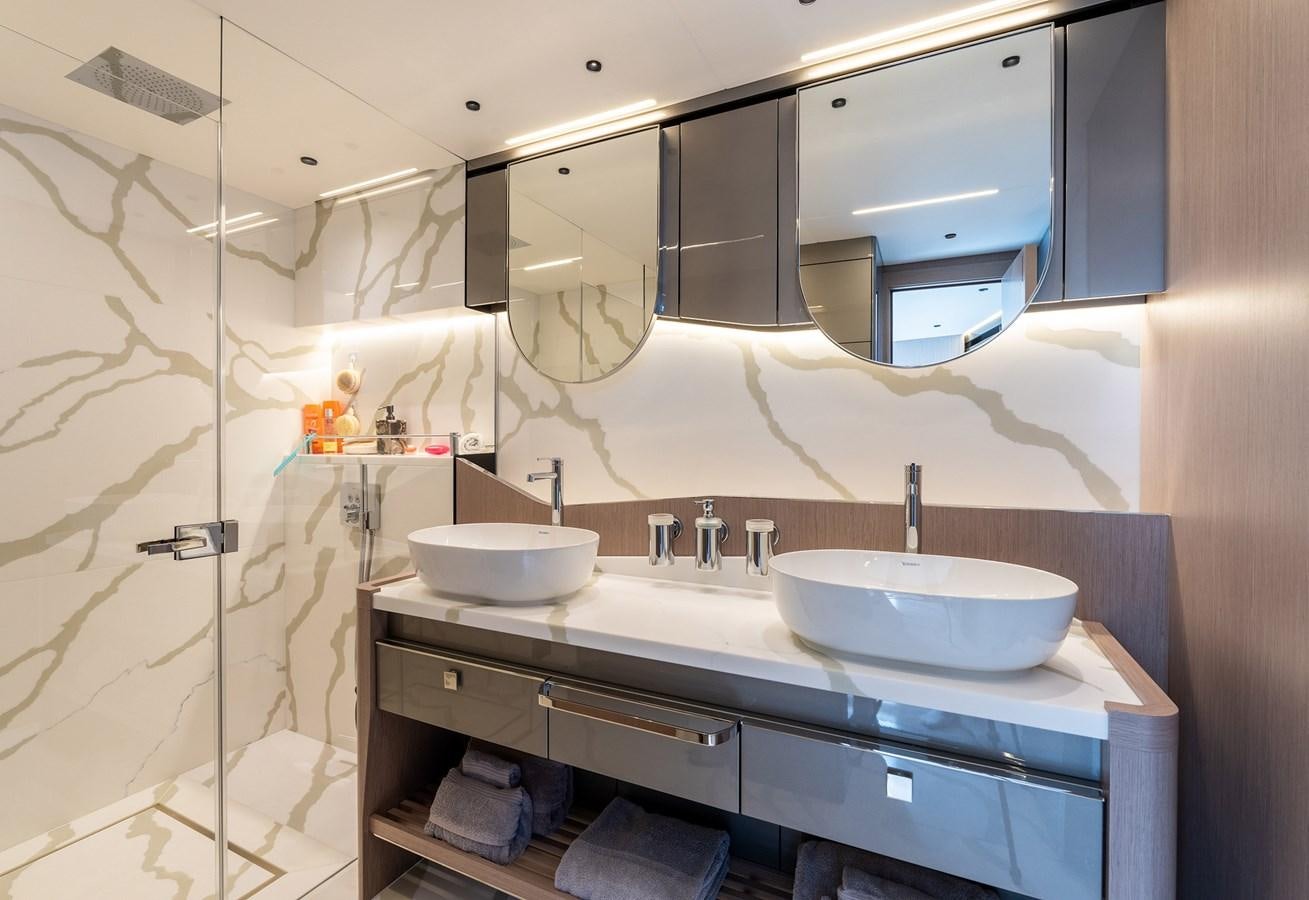 a bathroom with a sink and a shower aboard MAJIC Yacht for Sale