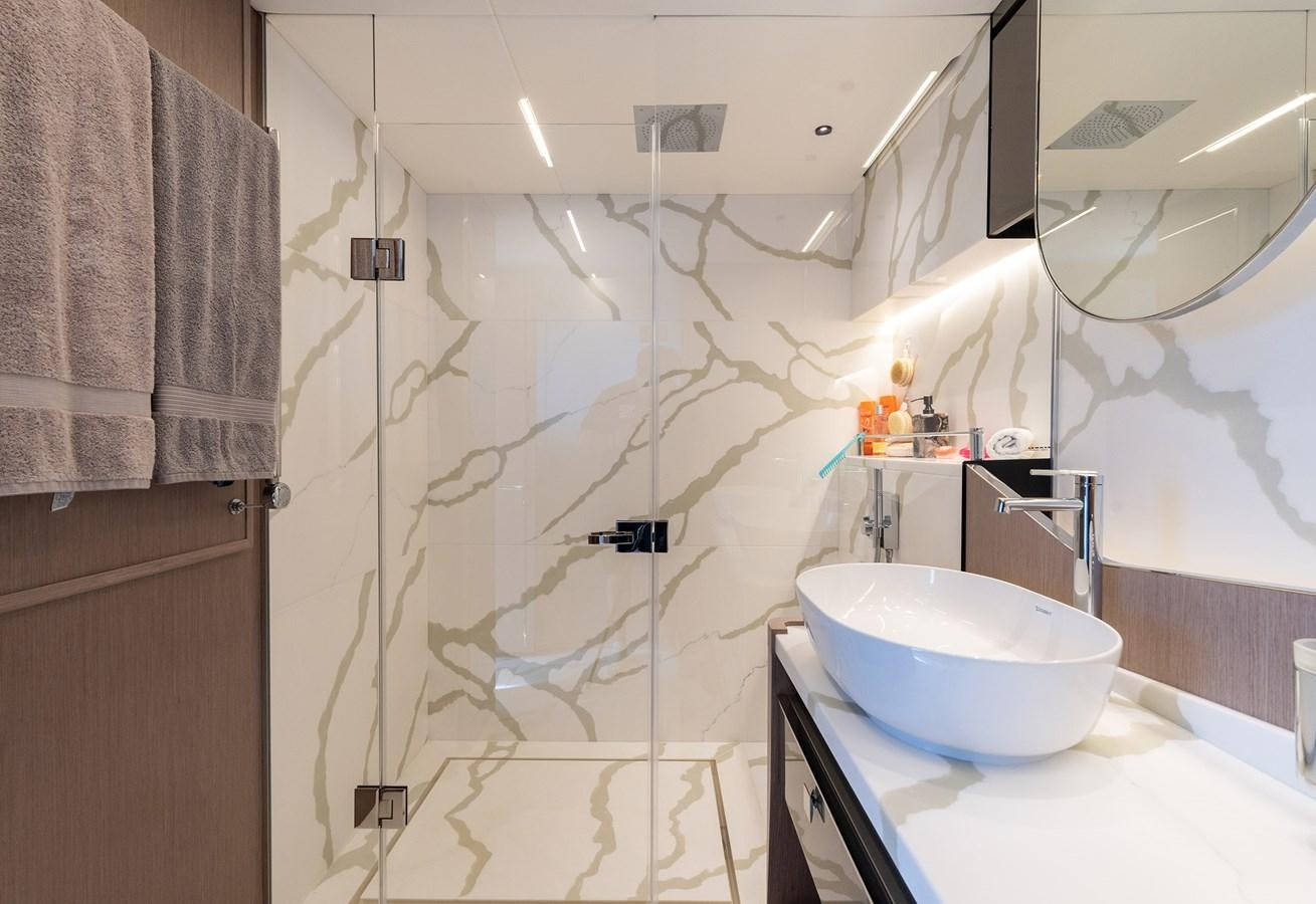 a bathroom with a sink and shower aboard MAJIC Yacht for Sale