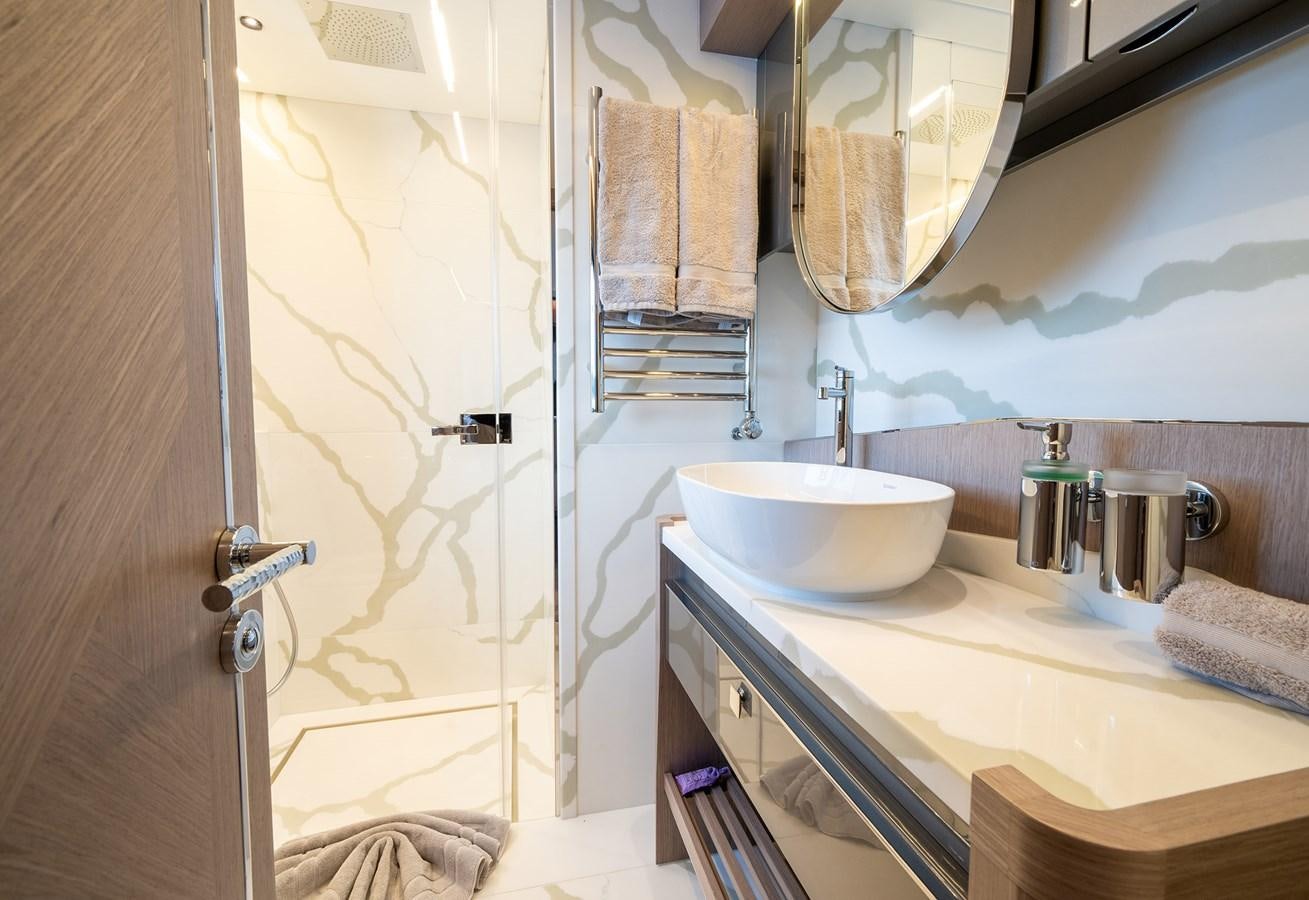 a bathroom with a sink and a shower aboard MAJIC Yacht for Sale