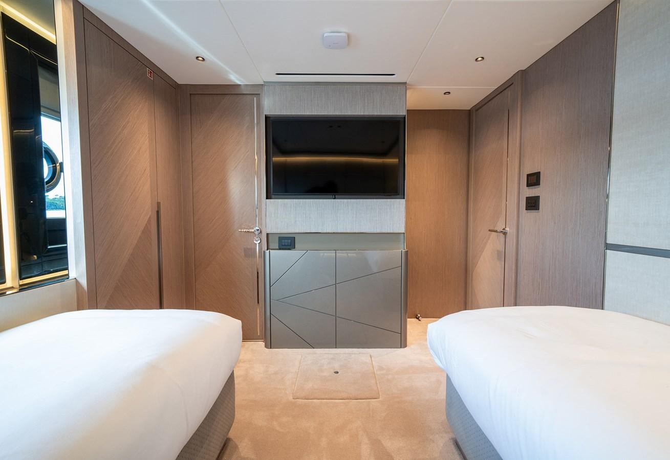 a room with a bed and a closet aboard MAJIC Yacht for Sale