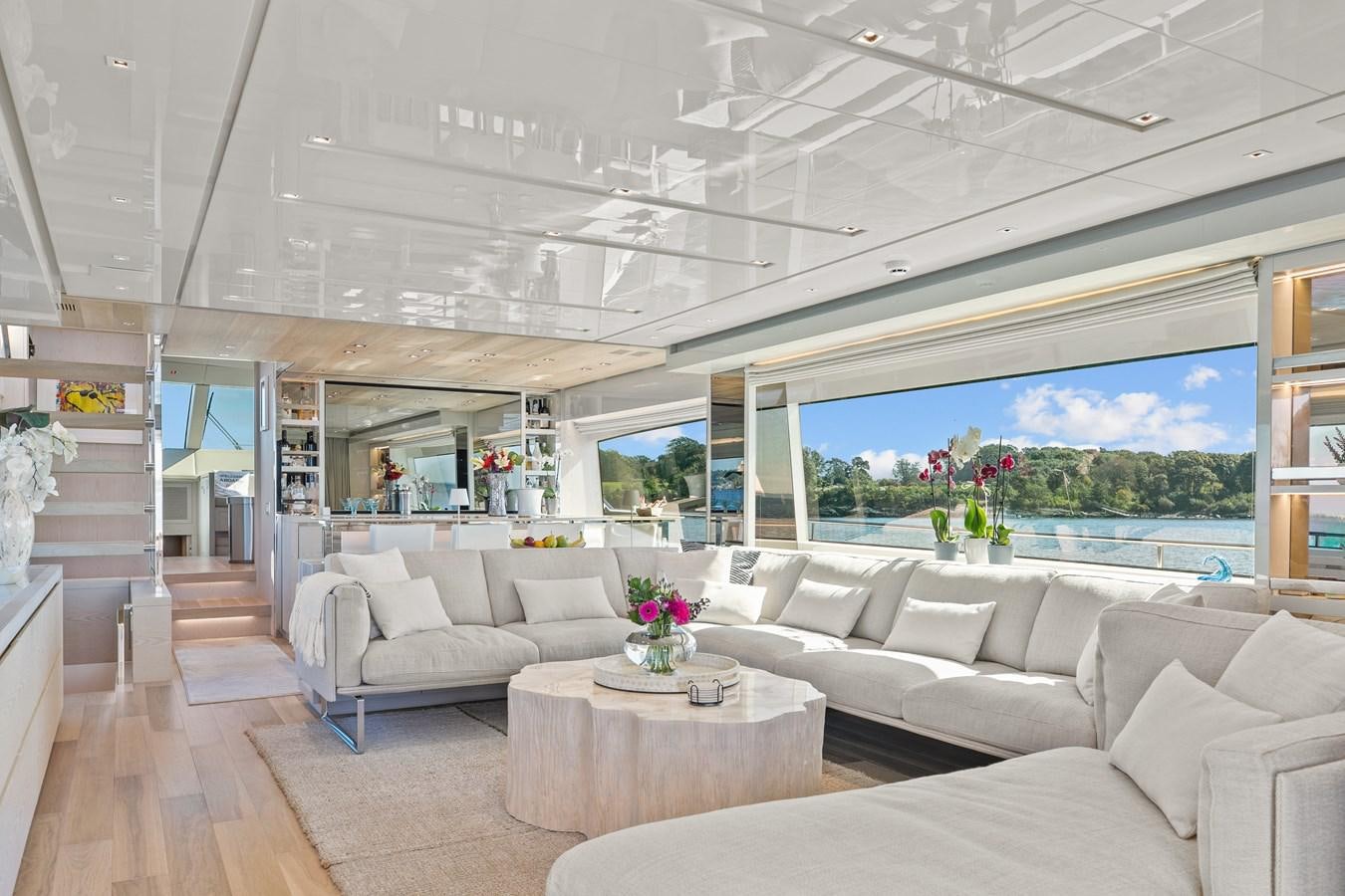 a living room with a large window aboard MISS LIZA Yacht for Sale