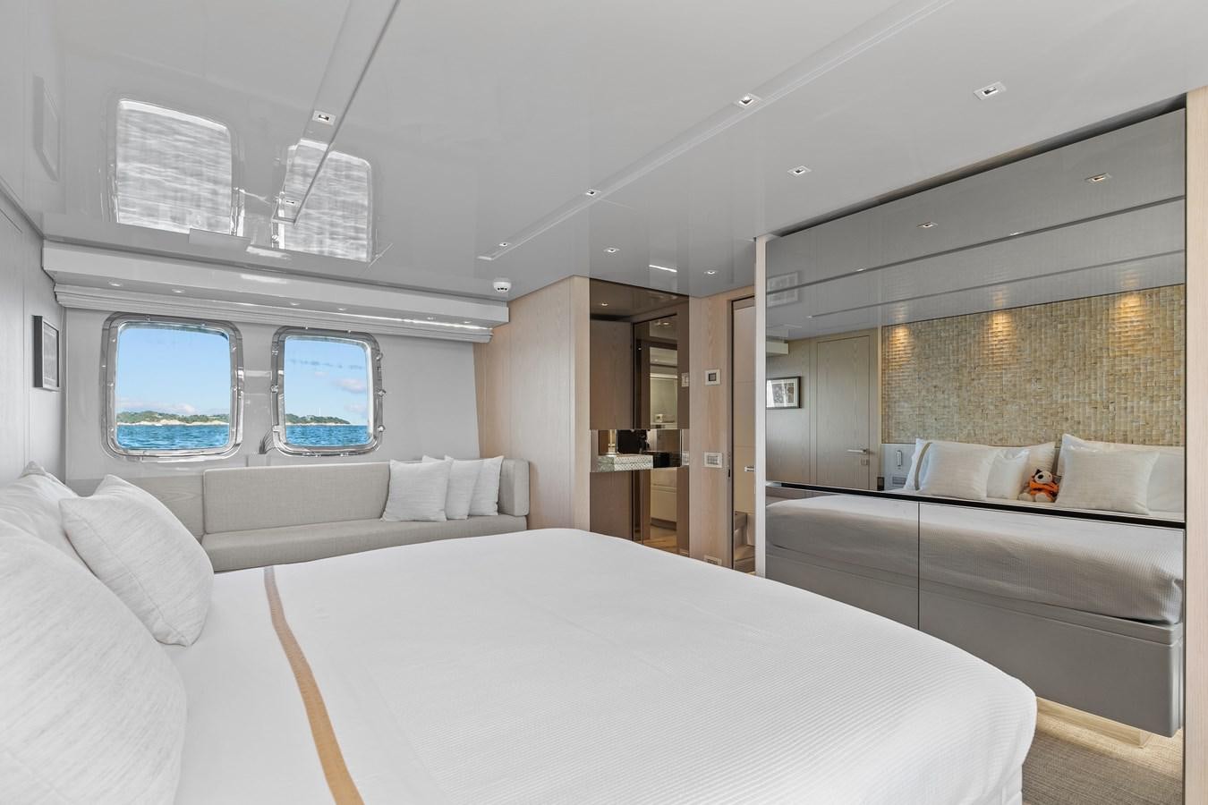 a room with a bed and a window aboard MISS LIZA Yacht for Sale