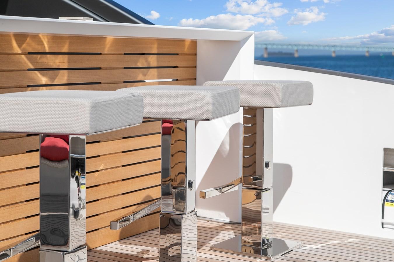 a deck with a deck and a view of the water aboard MISS LIZA Yacht for Sale