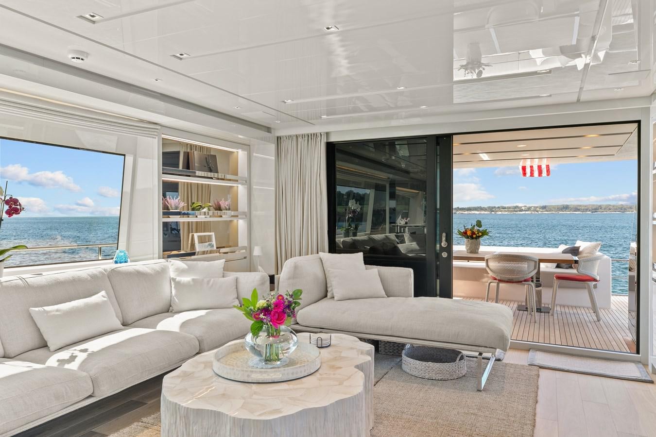 a living room with a large window aboard MISS LIZA Yacht for Sale