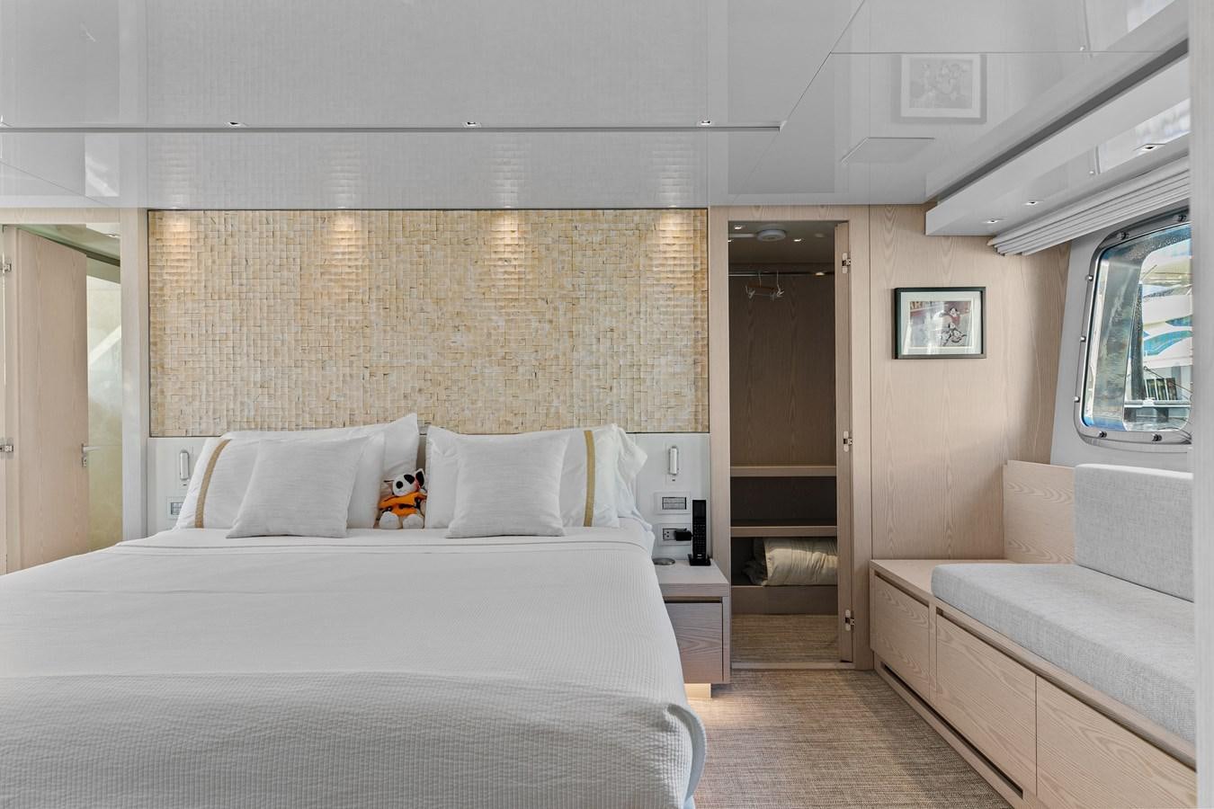 a bedroom with a bed and a couch aboard MISS LIZA Yacht for Sale