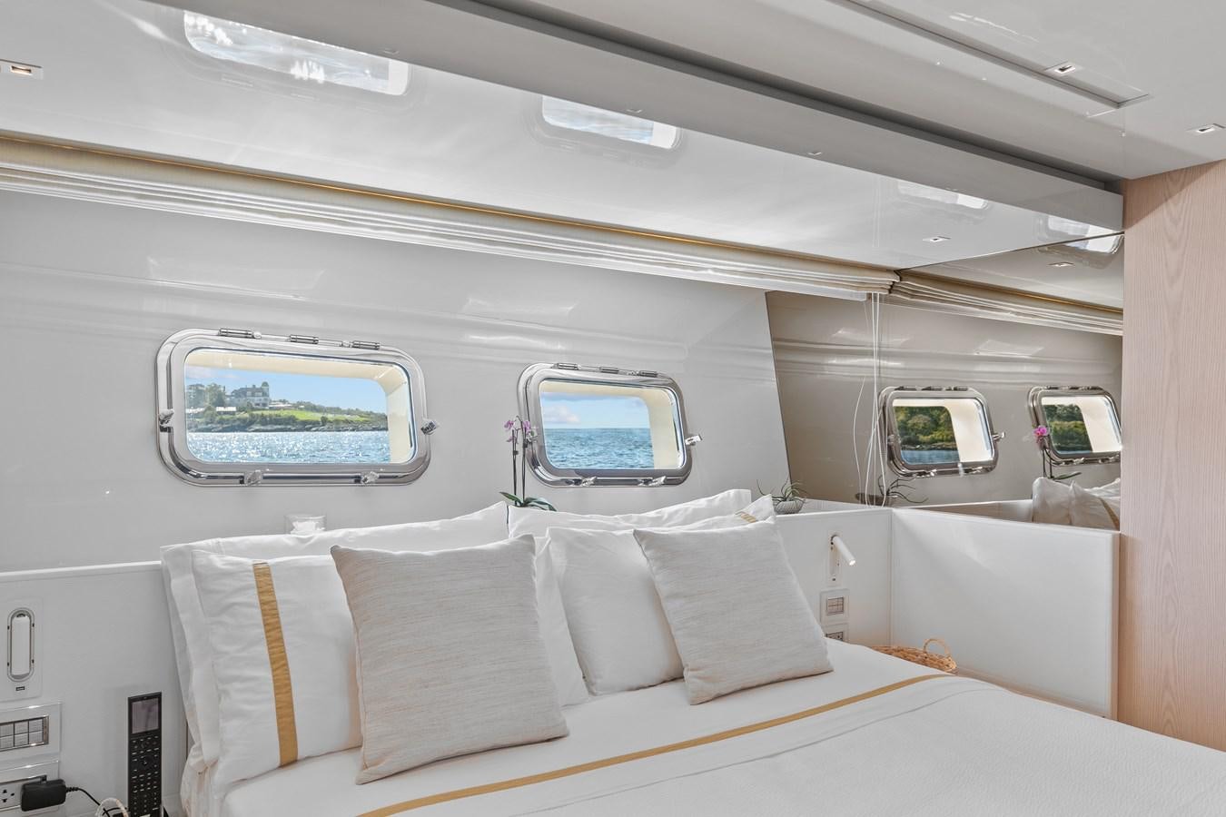 a room with a bed and a window aboard MISS LIZA Yacht for Sale