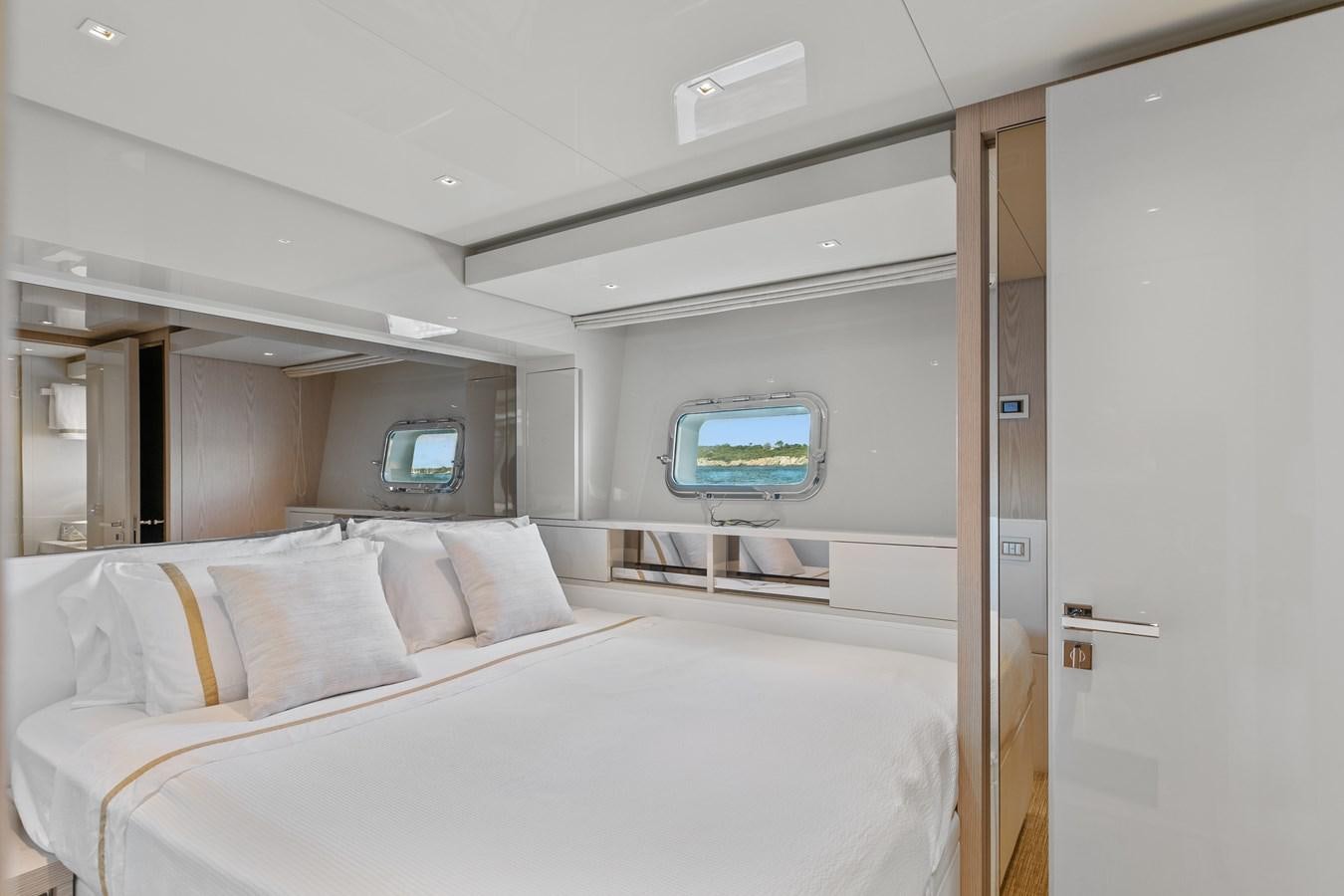 a room with a bed and a window aboard MISS LIZA Yacht for Sale