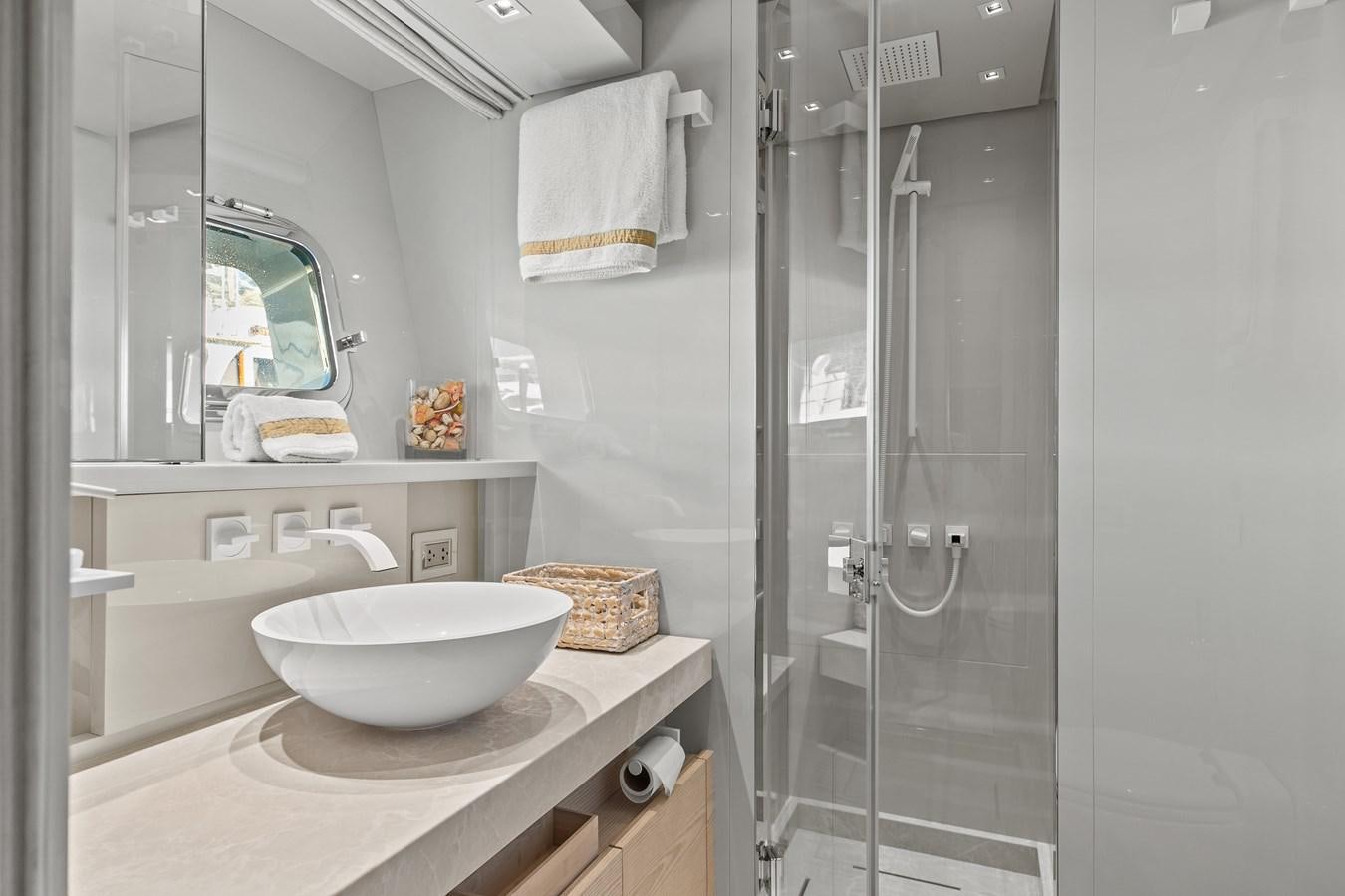 a bathroom with a sink and shower aboard MISS LIZA Yacht for Sale
