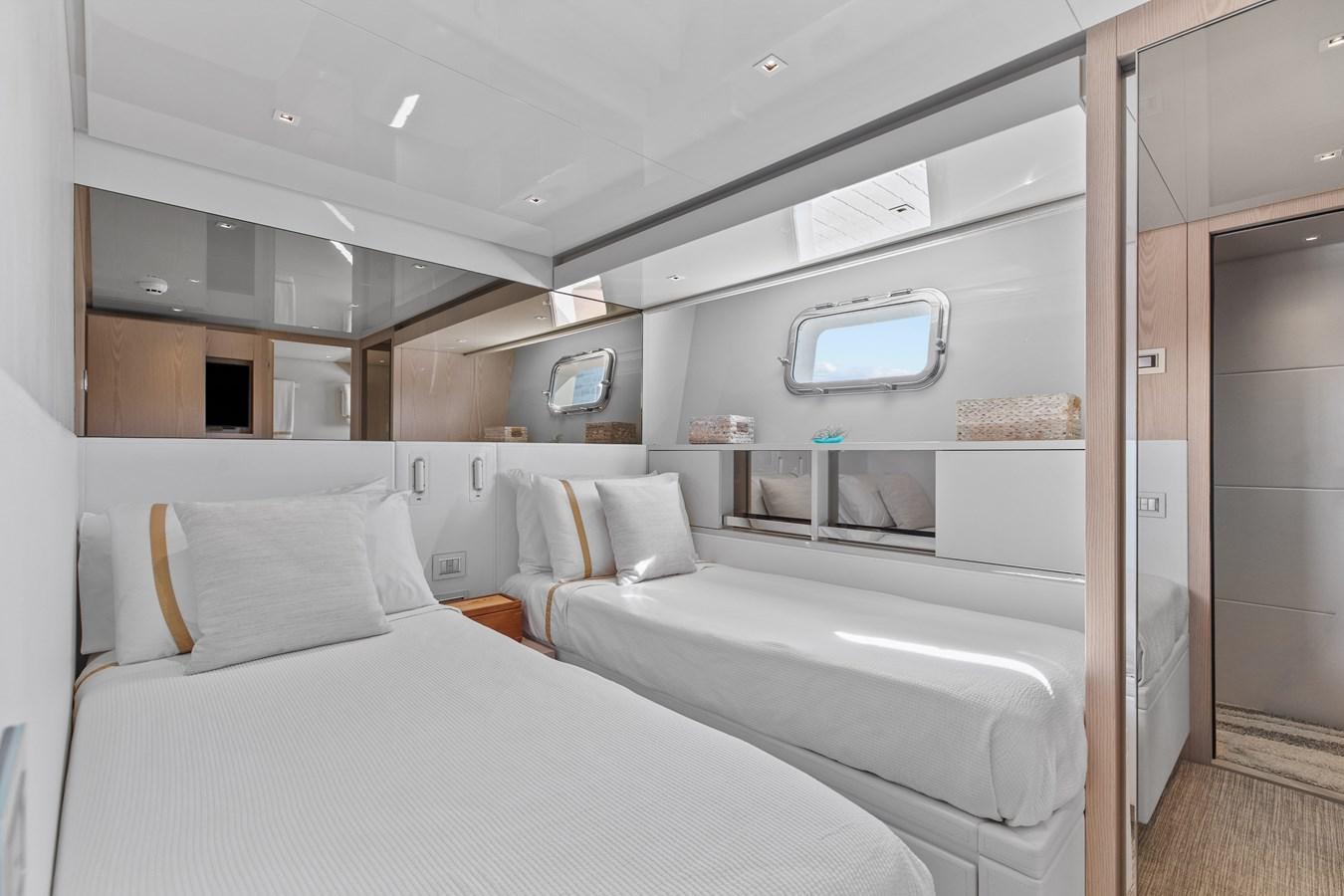 a room with a bed and a mirror aboard MISS LIZA Yacht for Sale