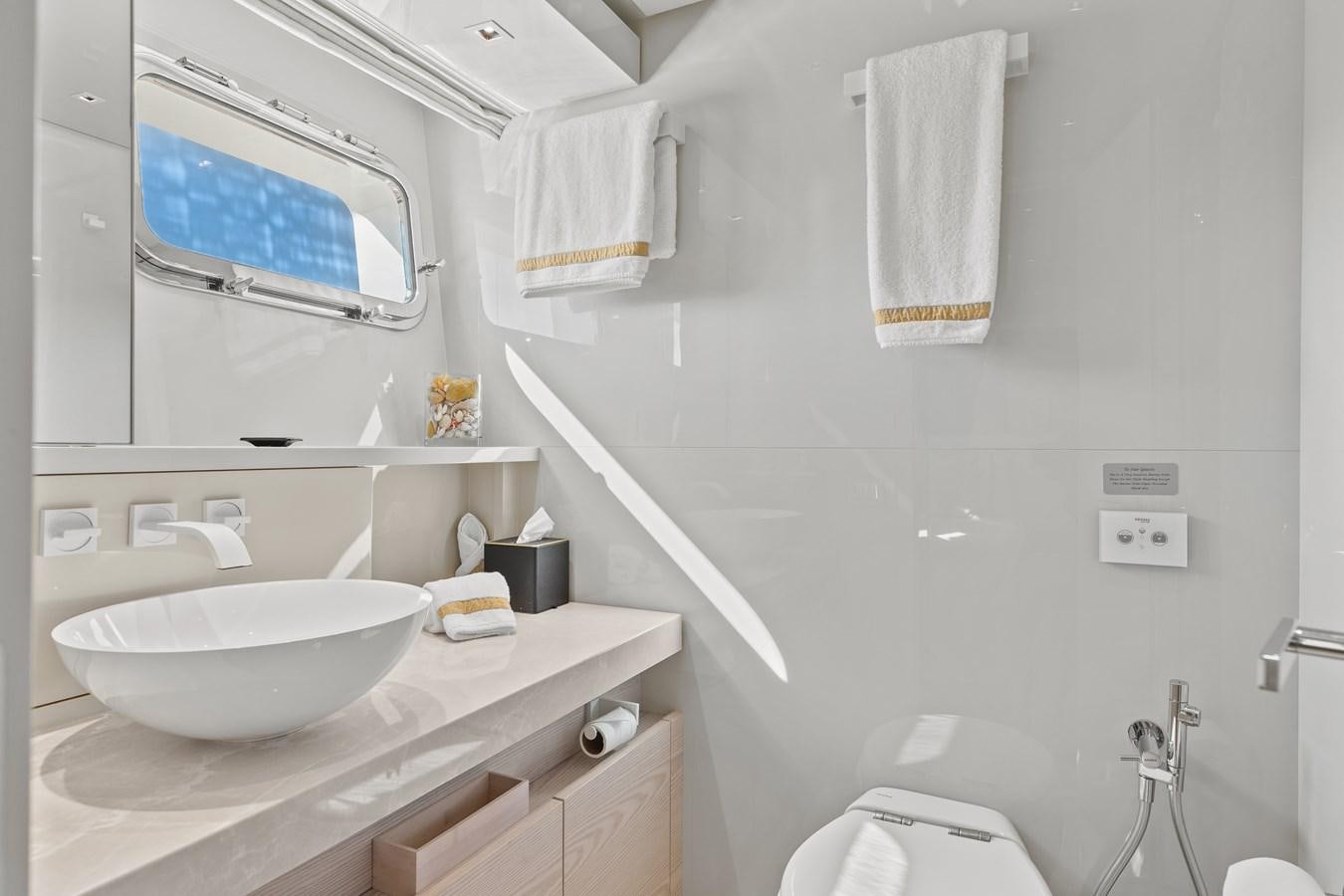 a bathroom with a sink and toilet aboard MISS LIZA Yacht for Sale