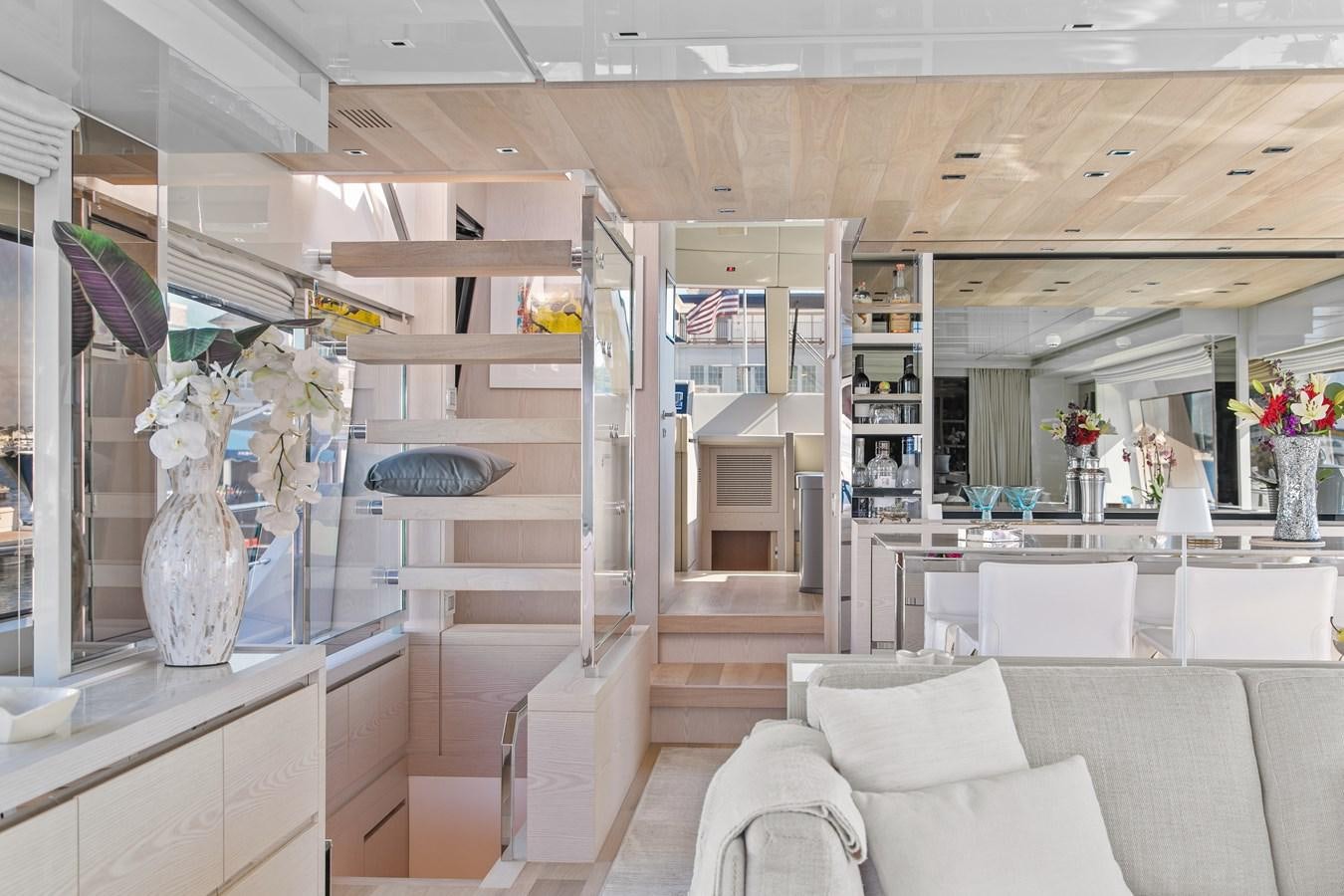 a room with a couch and a table aboard MISS LIZA Yacht for Sale