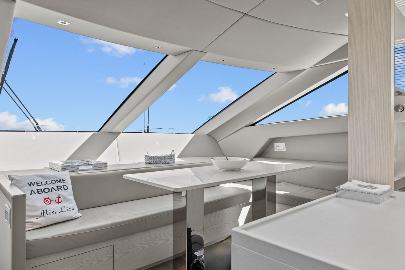 a white table on a boat aboard MISS LIZA Yacht for Sale