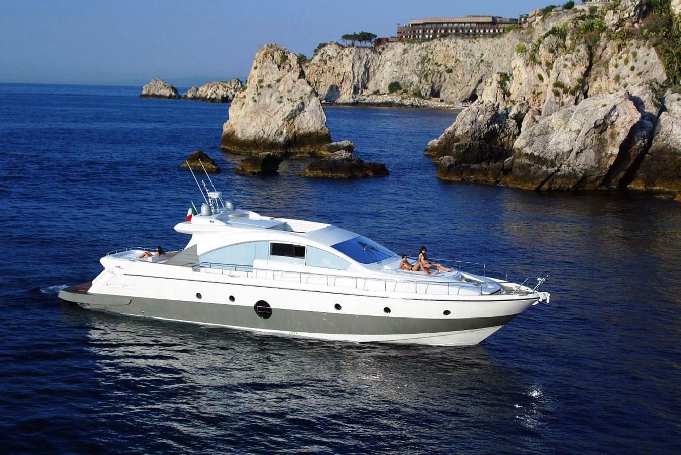 a white boat in the water aboard SLO Yacht for Sale