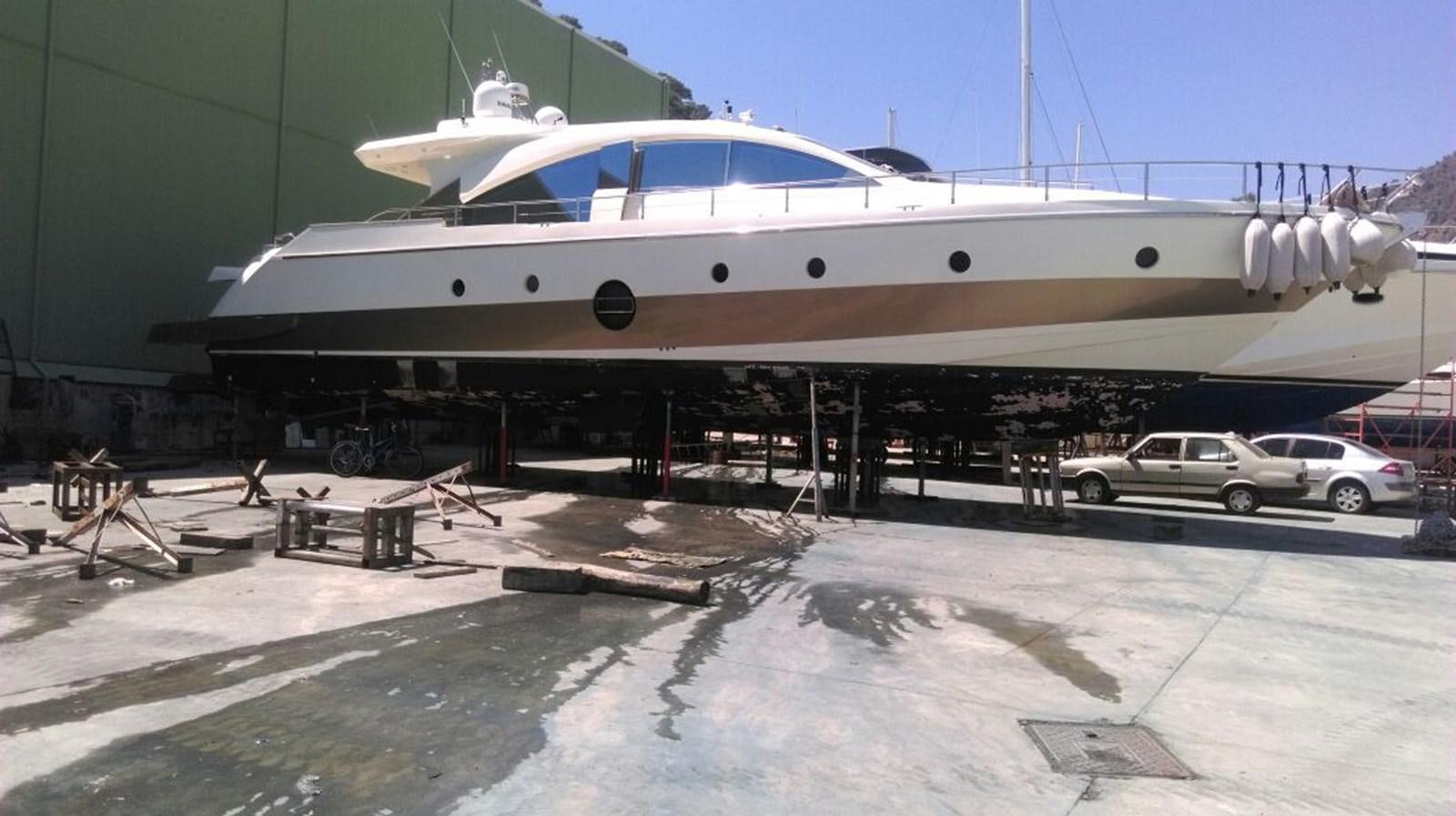 a boat parked on the side of a road aboard SLO Yacht for Sale