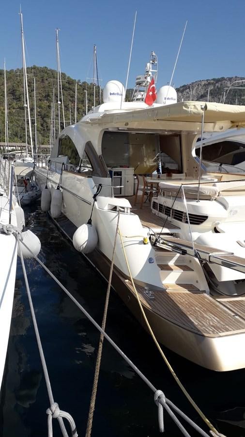a boat docked at a pier aboard SLO Yacht for Sale