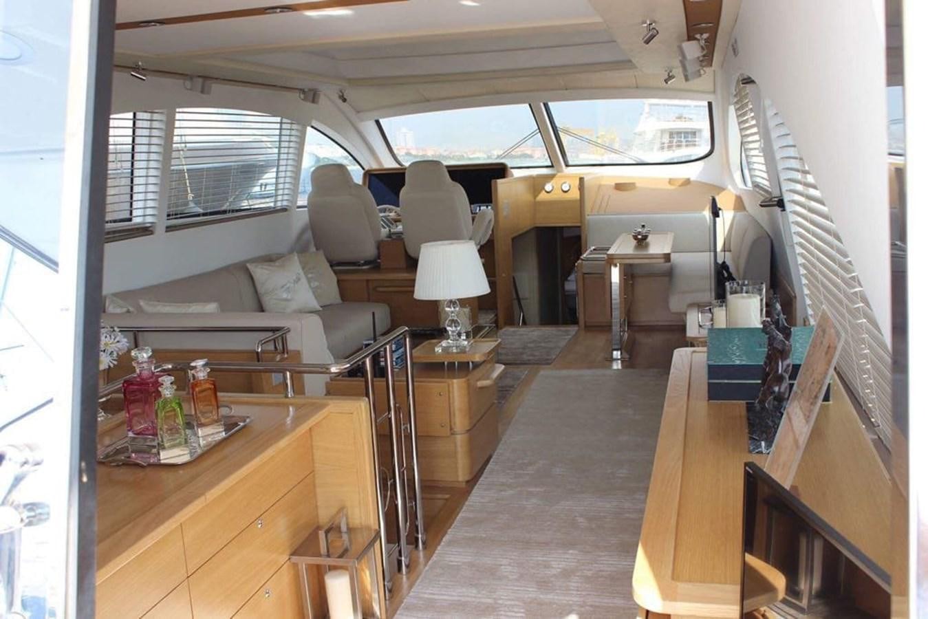 a room with a couch and a table aboard SLO Yacht for Sale