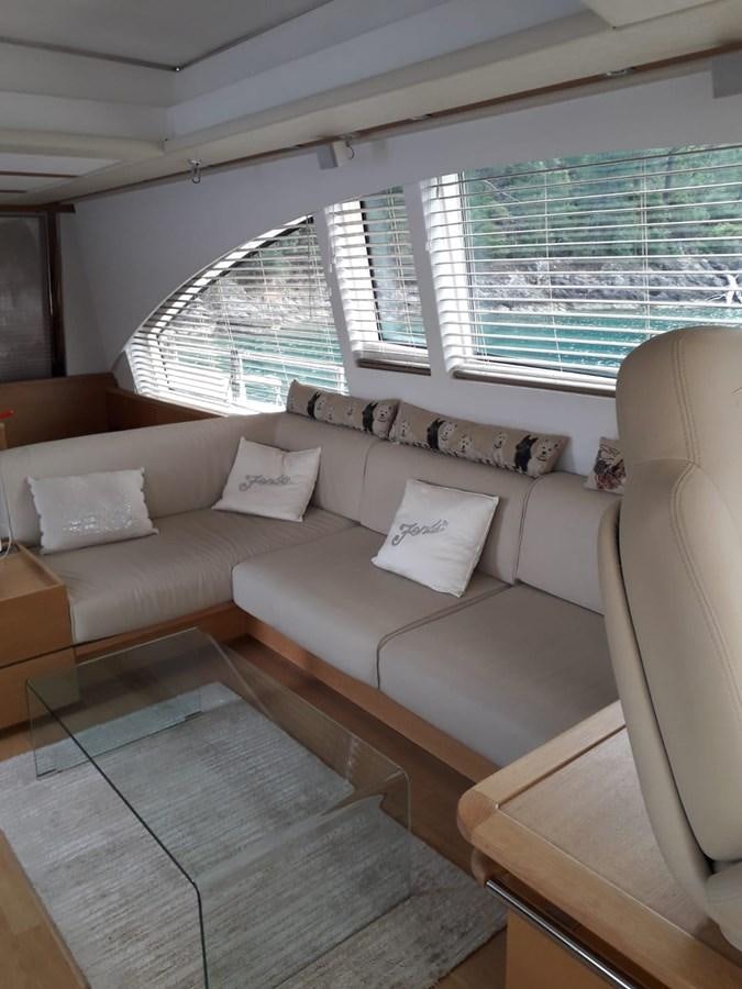 a living room with a couch aboard SLO Yacht for Sale