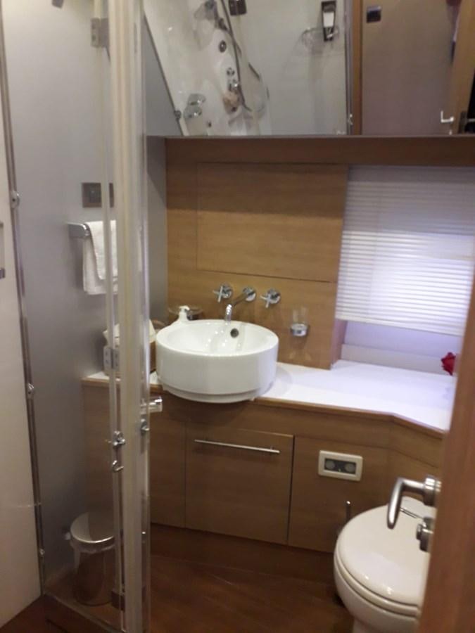 a bathroom with a sink toilet and bathtub aboard SLO Yacht for Sale