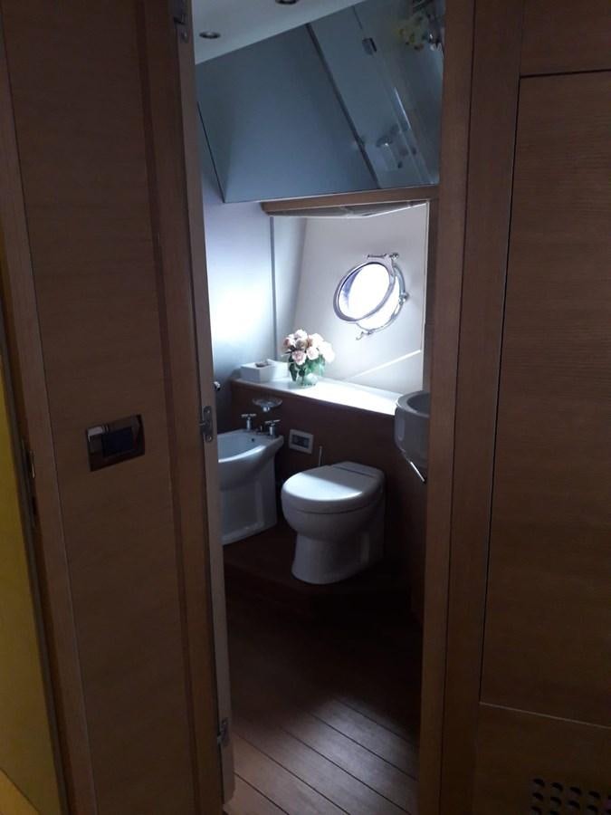 a bathroom with a toilet and sink aboard SLO Yacht for Sale