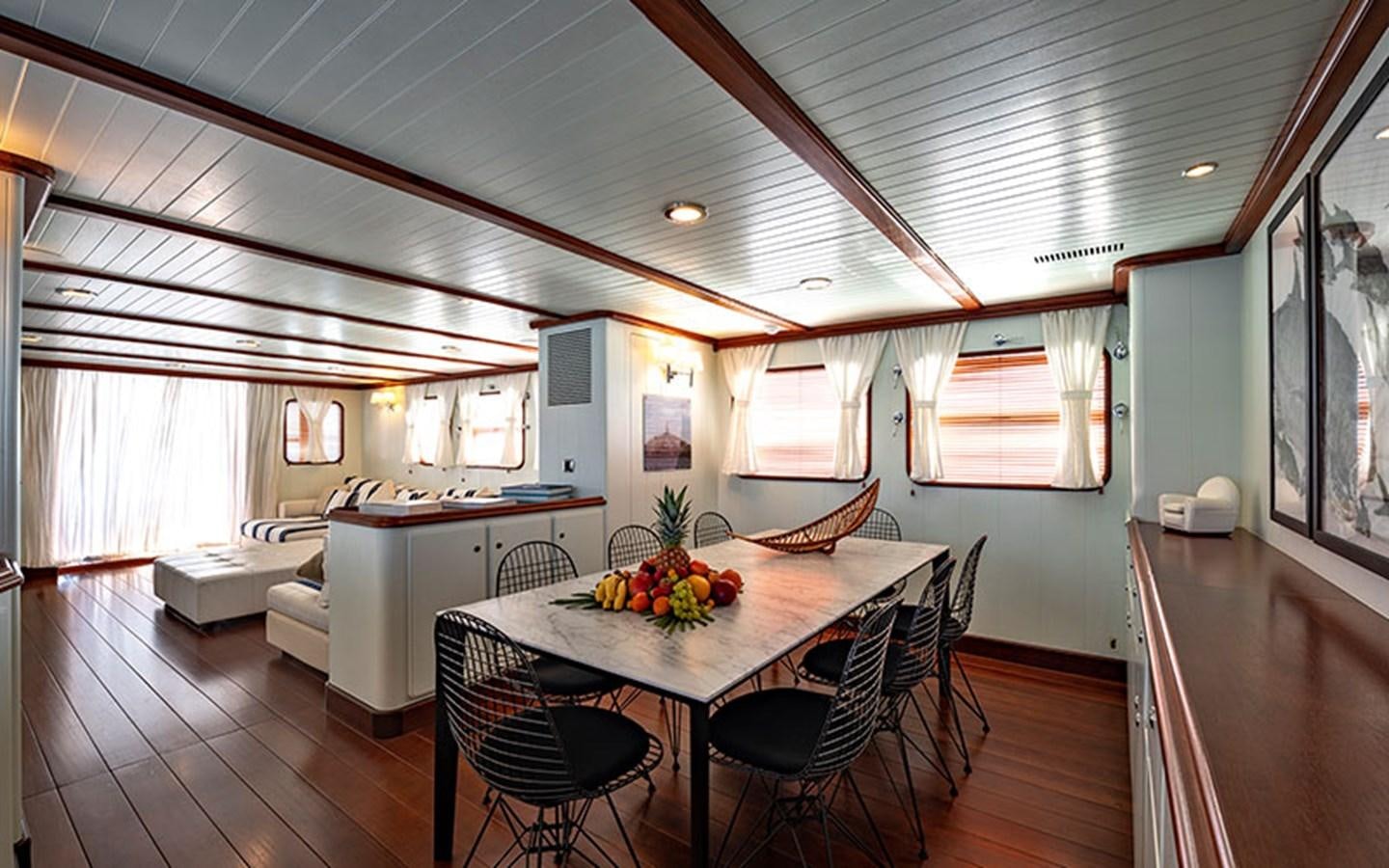 a kitchen and dining area aboard PERSUADER Yacht for Sale