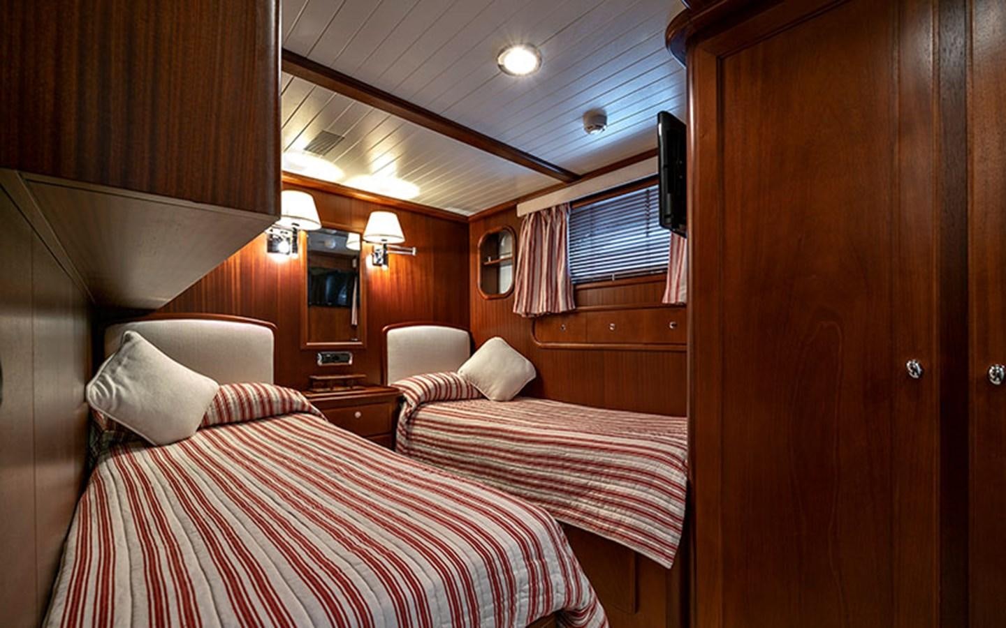 a room with two beds aboard PERSUADER Yacht for Sale