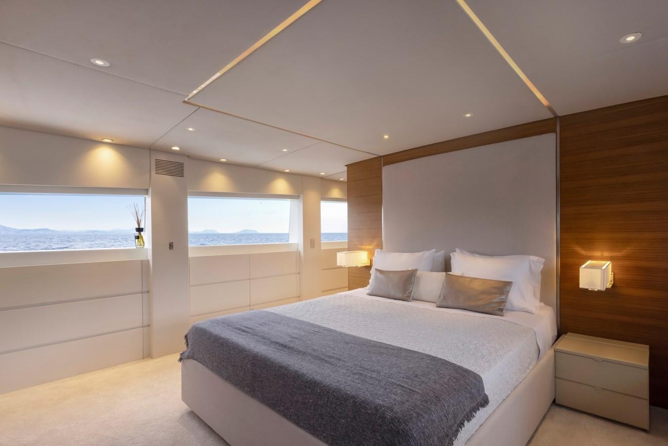 a large bedroom with a large bed aboard TROPICANA Yacht for Sale