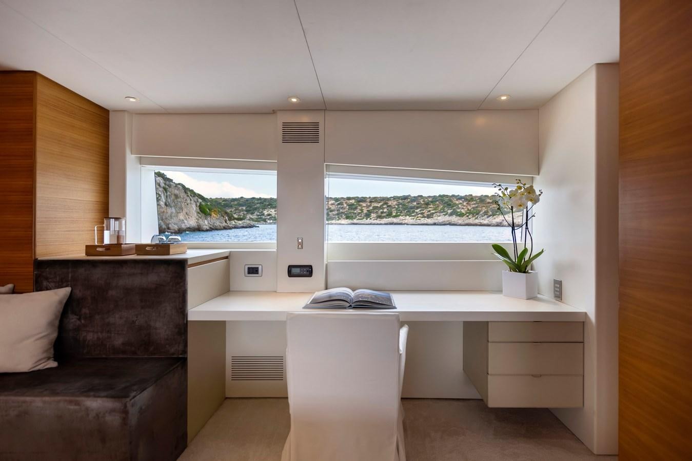 a room with a couch and a table aboard TROPICANA Yacht for Sale