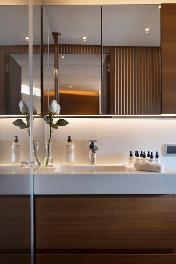 a bathroom with a vase of flowers aboard TROPICANA Yacht for Sale