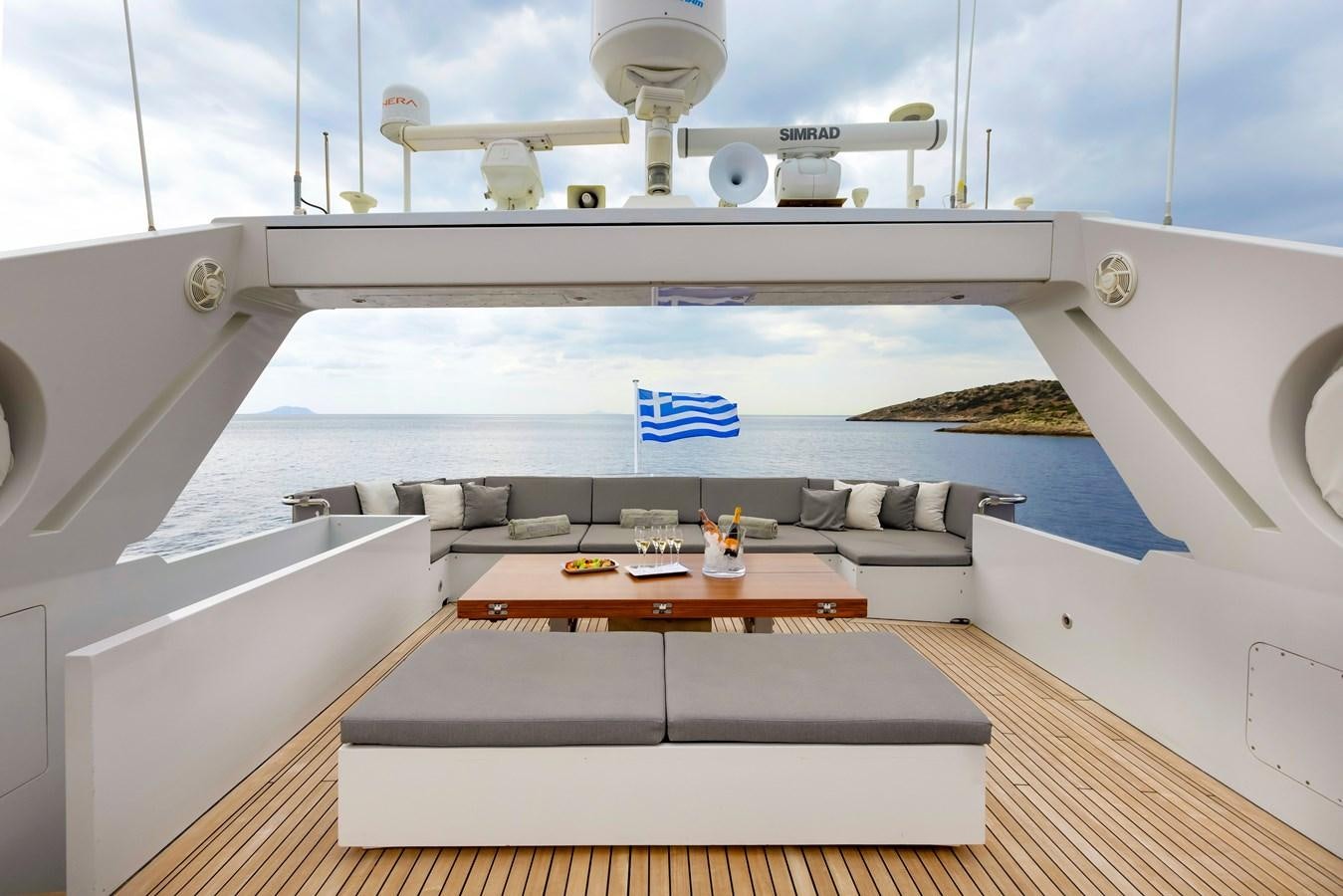 a room with a table and a couch aboard TROPICANA Yacht for Sale