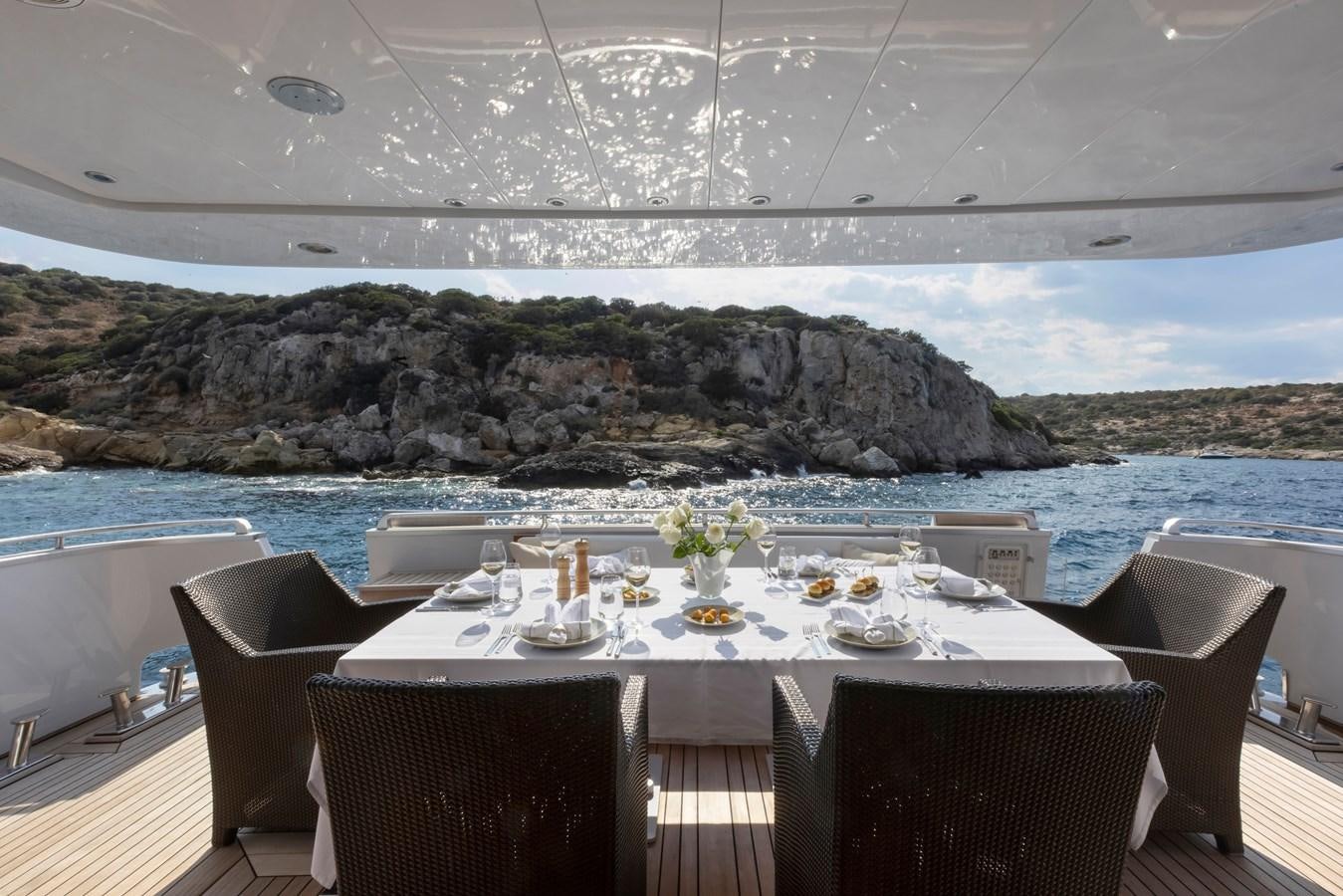 a table set for a meal on a boat aboard TROPICANA Yacht for Sale