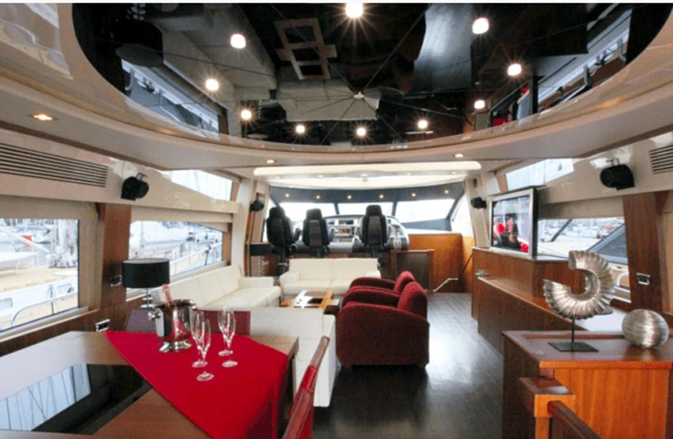 a room with a table and chairs aboard NOVA 92 Yacht for Sale