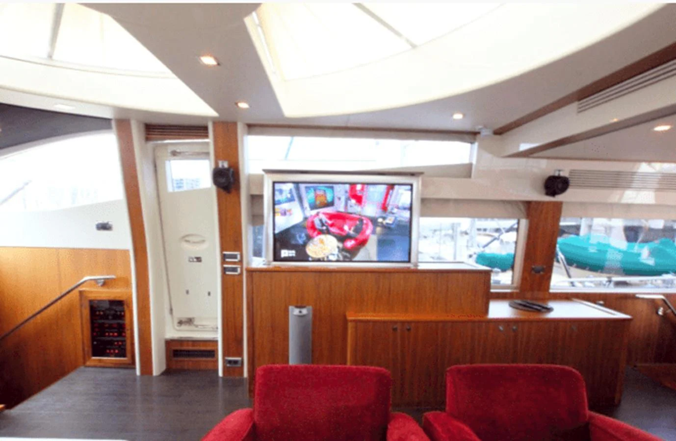 a room with a pool table and chairs aboard NOVA 92 Yacht for Sale