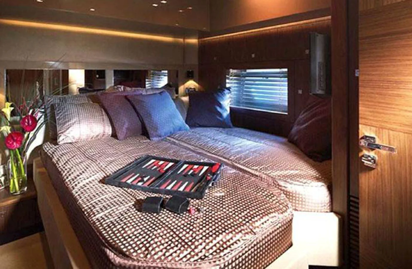 a bed with a flowered bed aboard NOVA 92 Yacht for Sale