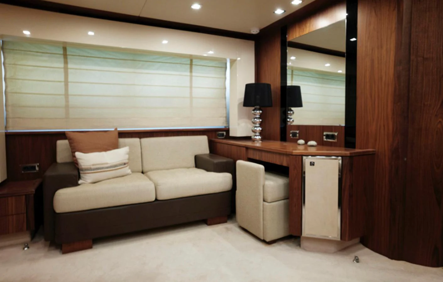 a living room with a couch and a desk aboard NOVA 92 Yacht for Sale
